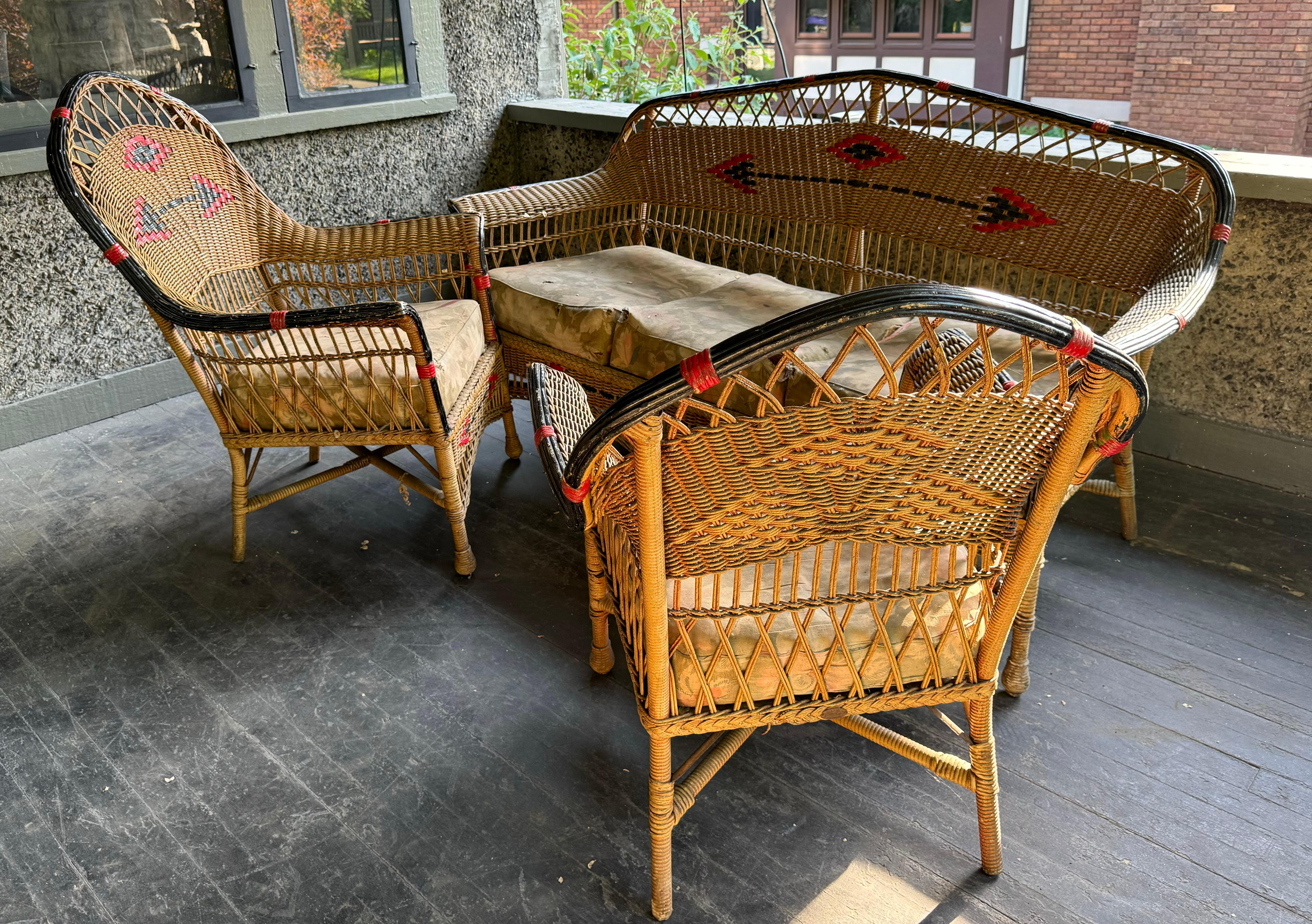 American 3-Piece aRT deco Stick Wicker / Reed Living Room Set , Sofa and matching lounge chairs.  Retains original finish / patina,,Wonderful black and red hand painted designs,,Also retains original heavy spring cushions (in need of