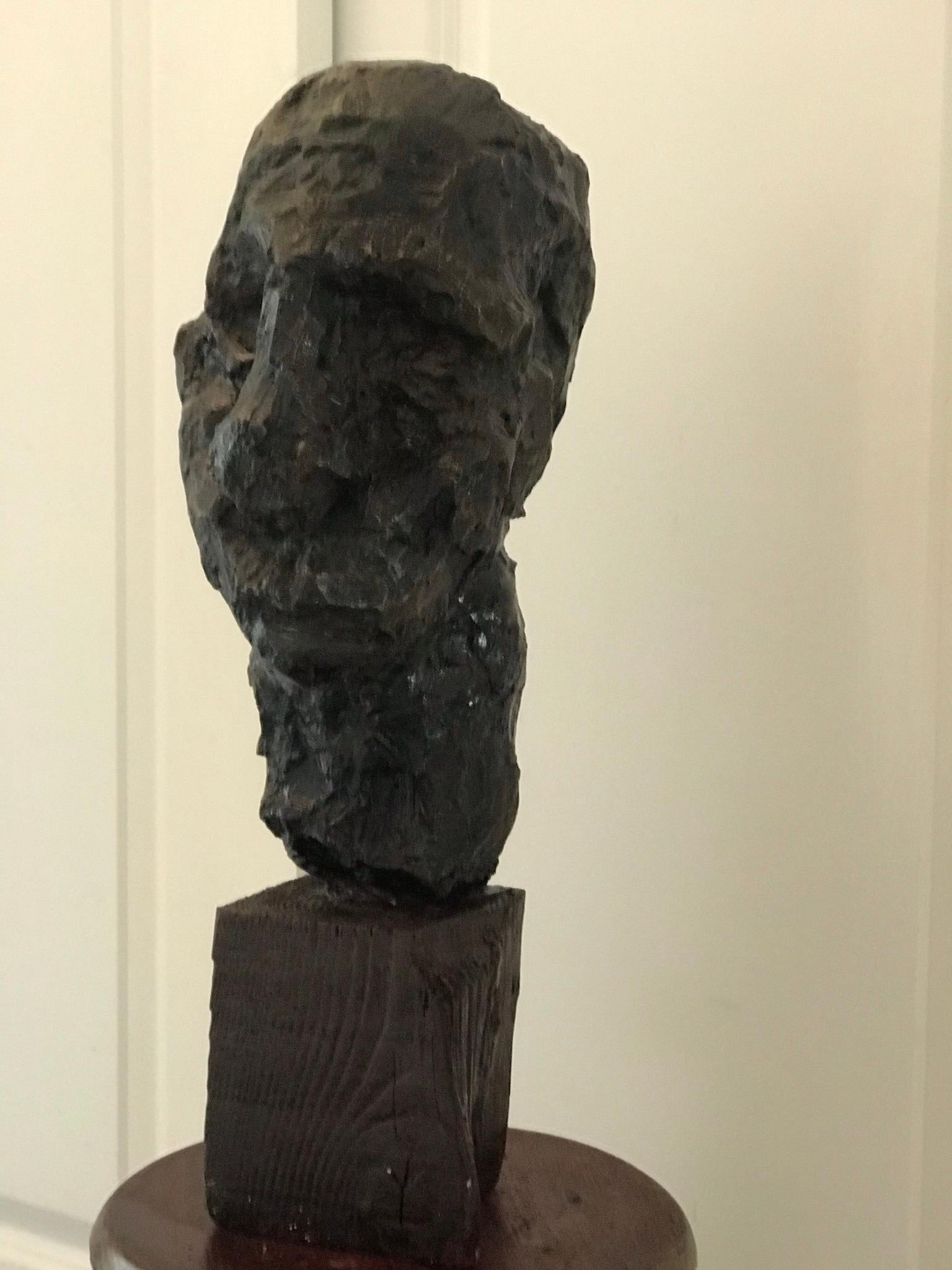 American abstract sculpture bust of a man on wood stand.
