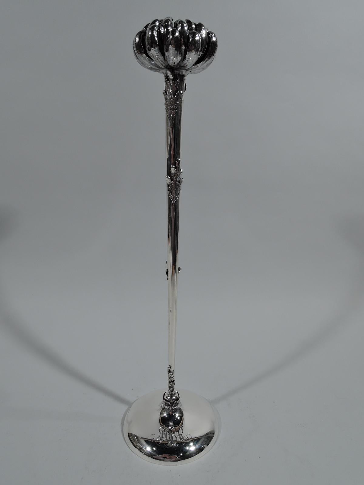 Aesthetic sterling silver vase, circa 1900. Tall and slender leaf-wrapped shooting stem shaft and chrysanthemum-form mouth with dense and tight petals. There’s room for one very rarified flower, or the vase can be appreciated all on its own as a