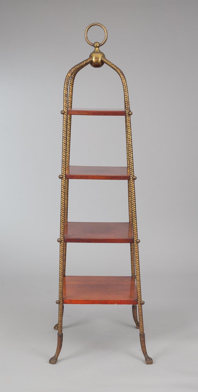 American Aesthetic Movement étagère with four graduated cherry shelves attached to rope-shaped frame, supported on cast brass claw feet topped by a ring finial.