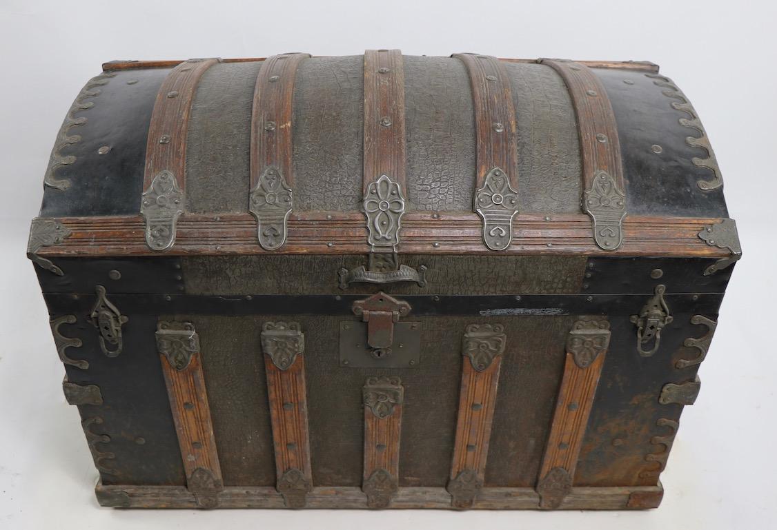 American dome top trunk with original insert till. This example is in good original condition, ready to use, missing leather handles.