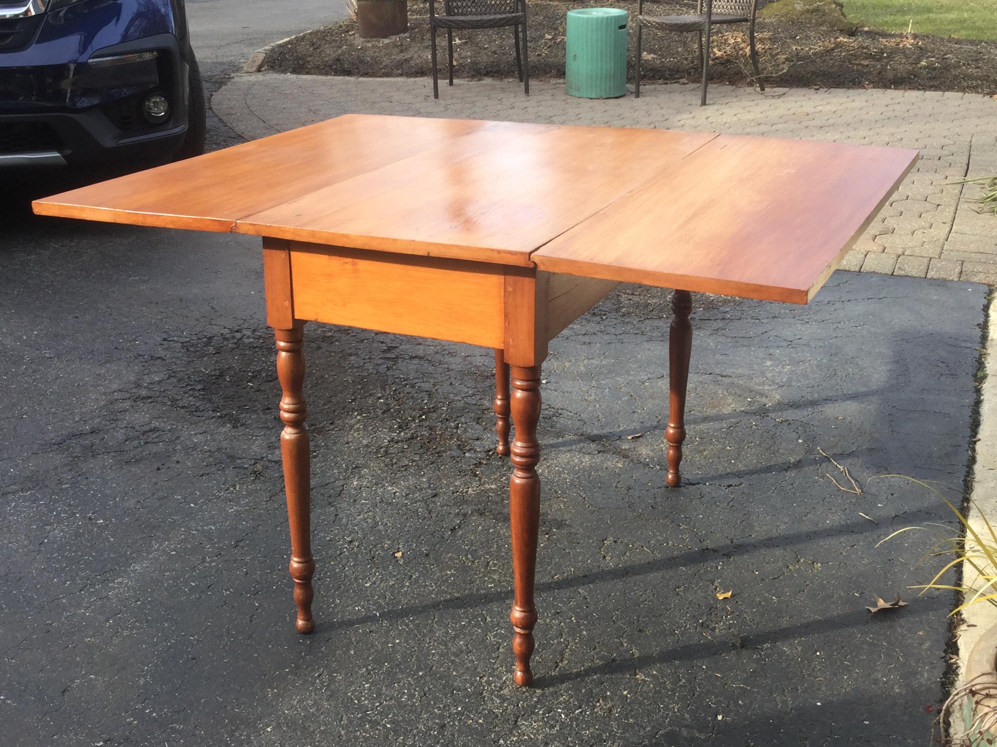 This American maple drop-leaf is made of solid maple and displays a rich, warm patina. This table is very versatile, while it may be used for dining or as a console table against the wall. This piece is solid and stable. Great apartment table.