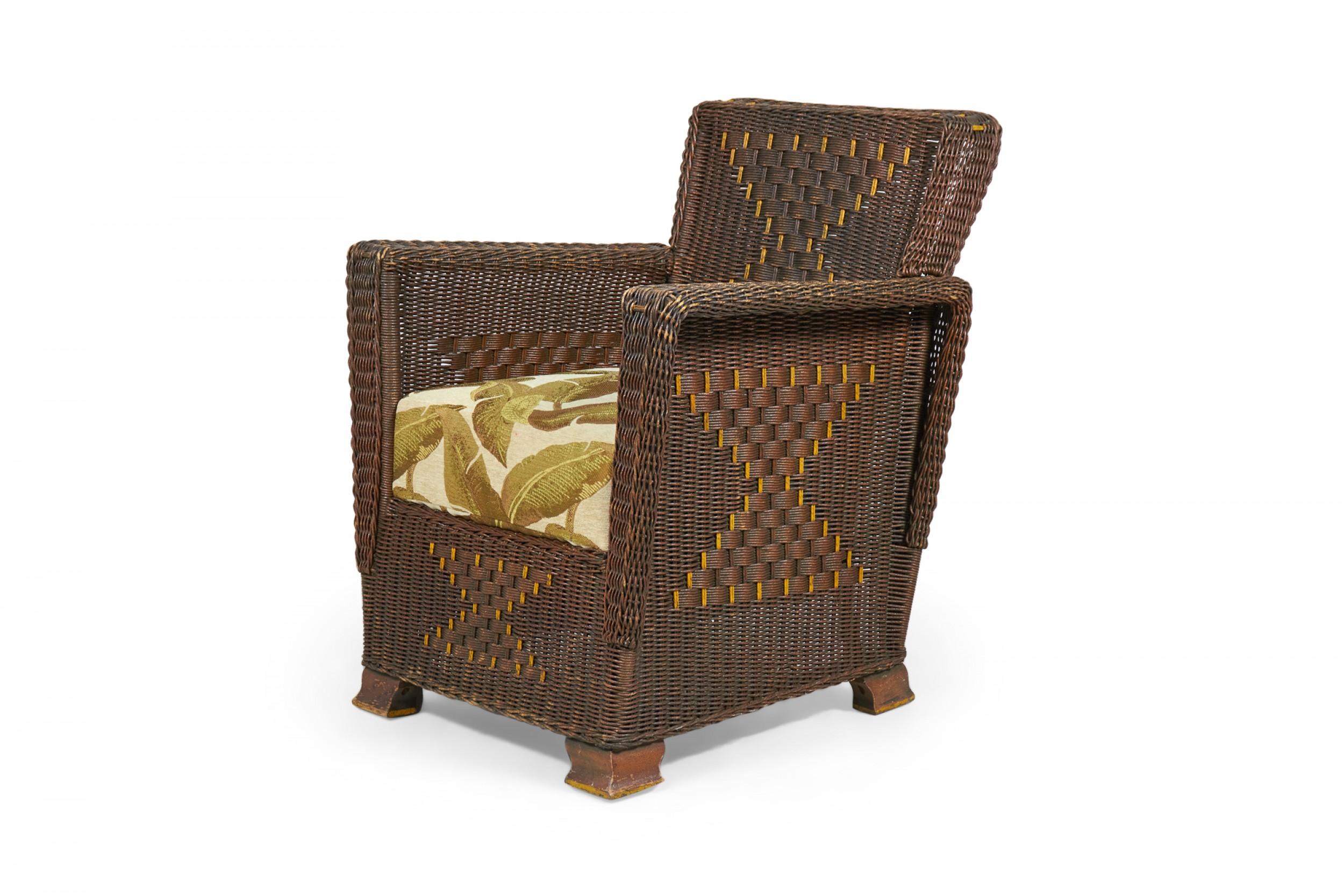 American Art Deco 3-piece dark brown wicker salon set comprised of a three-seat settee, a rocking chair, and an armchair, all with squared backs and arms with a woven hourglass pattern throughout and custom golden palm frond patterned seat cushions.