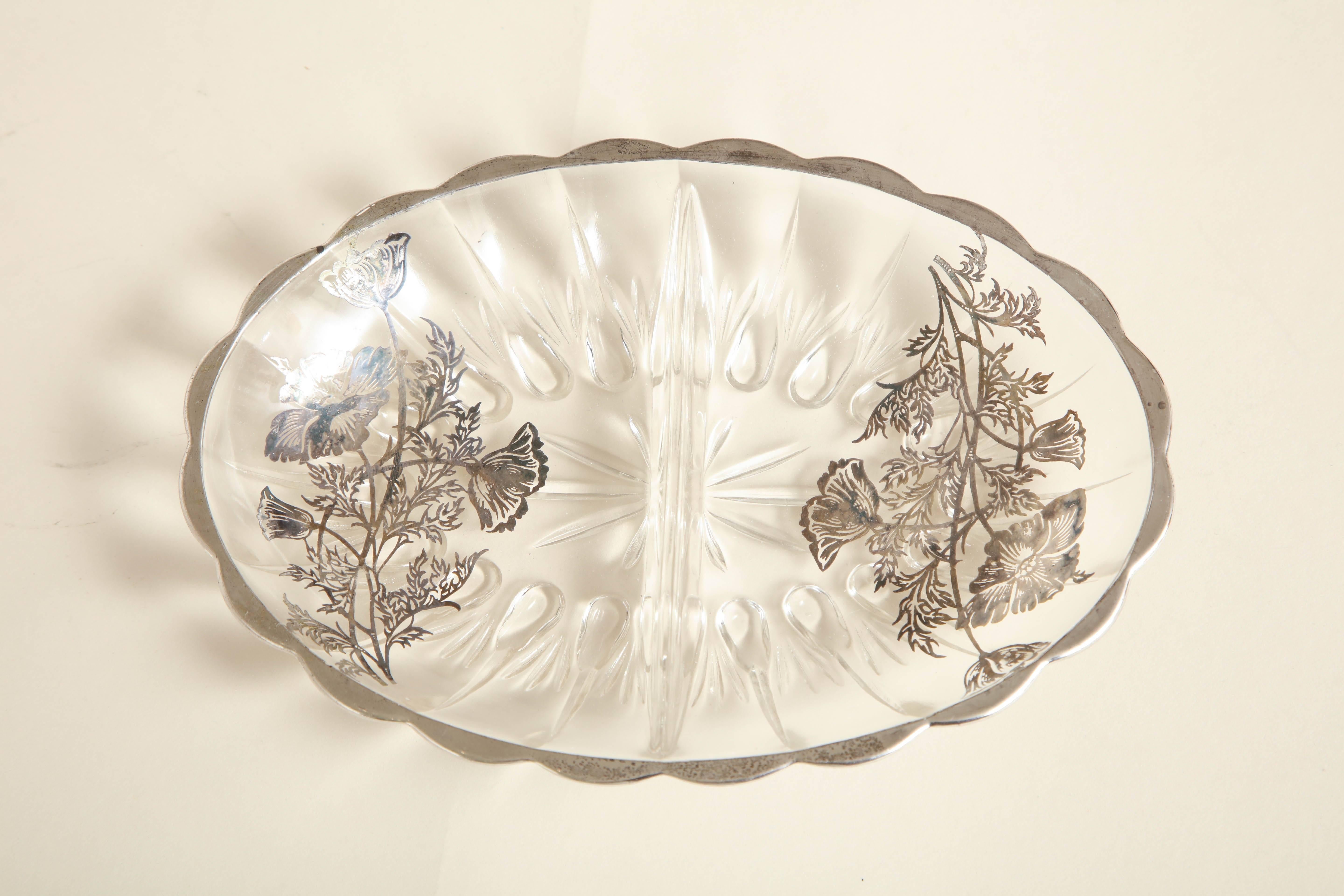 Clear molded art glass with silver resist floral overlay and silver scalloped rim.