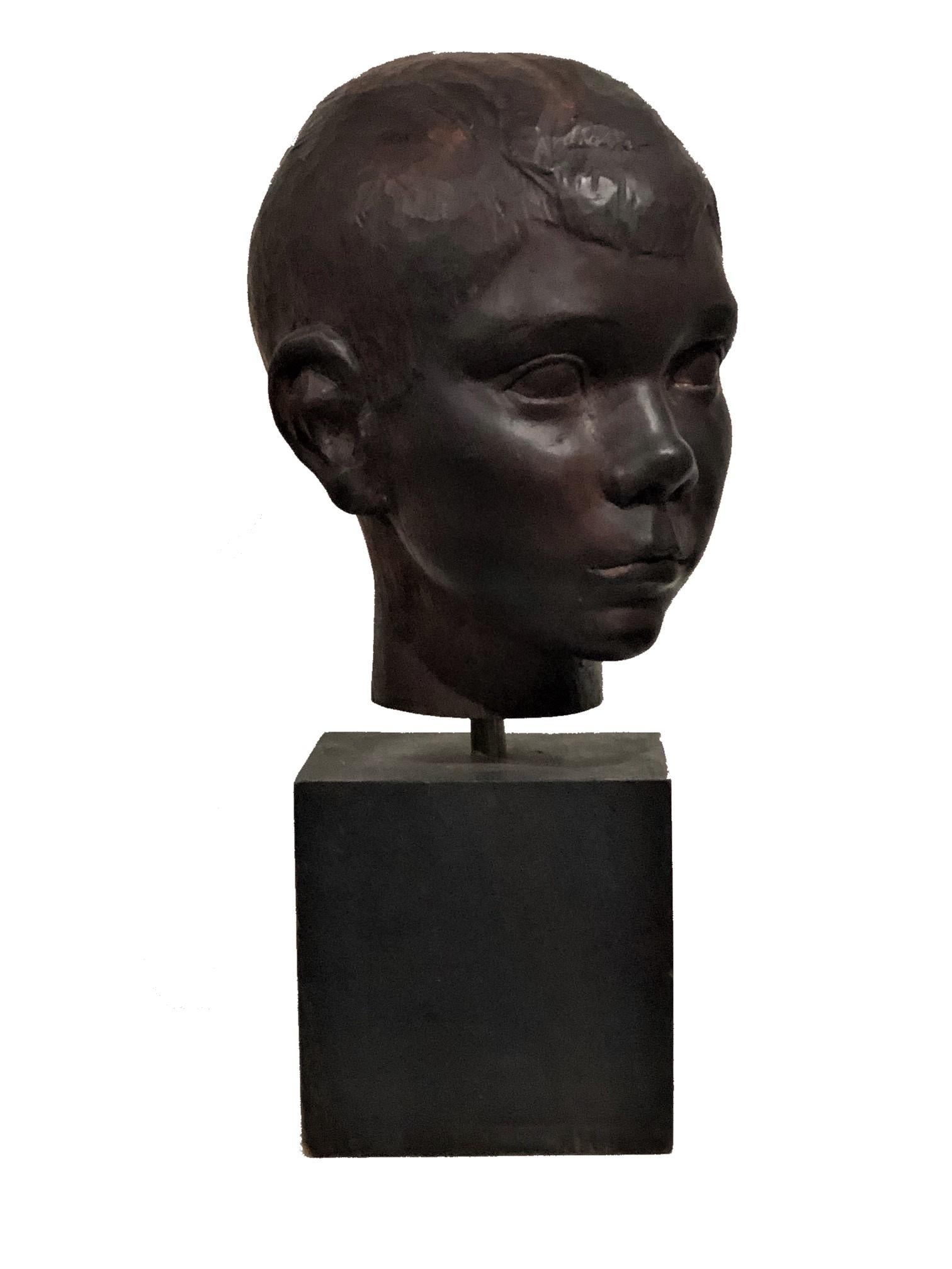 American Art Deco Carved Ebonized Wood Head Bust of a Young Boy, ca. 1940s In Good Condition For Sale In New York, NY