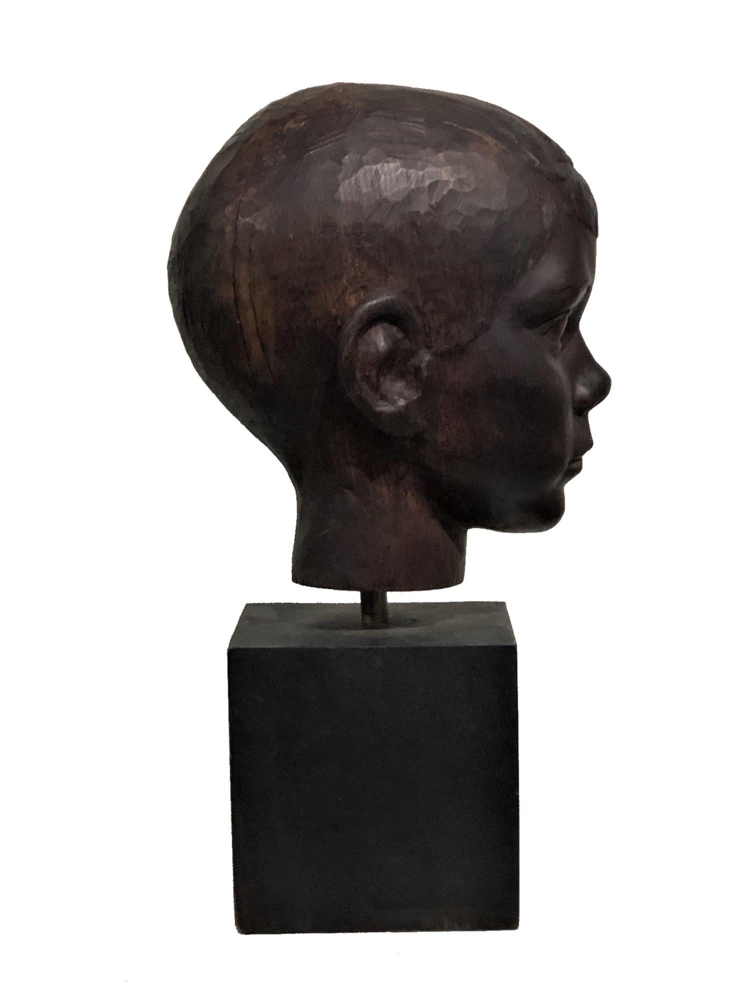 Mid-20th Century American Art Deco Carved Ebonized Wood Head Bust of a Young Boy, ca. 1940s For Sale
