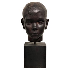 American Art Deco Carved Ebonized Wood Head Bust of a Young Boy, ca. 1940s