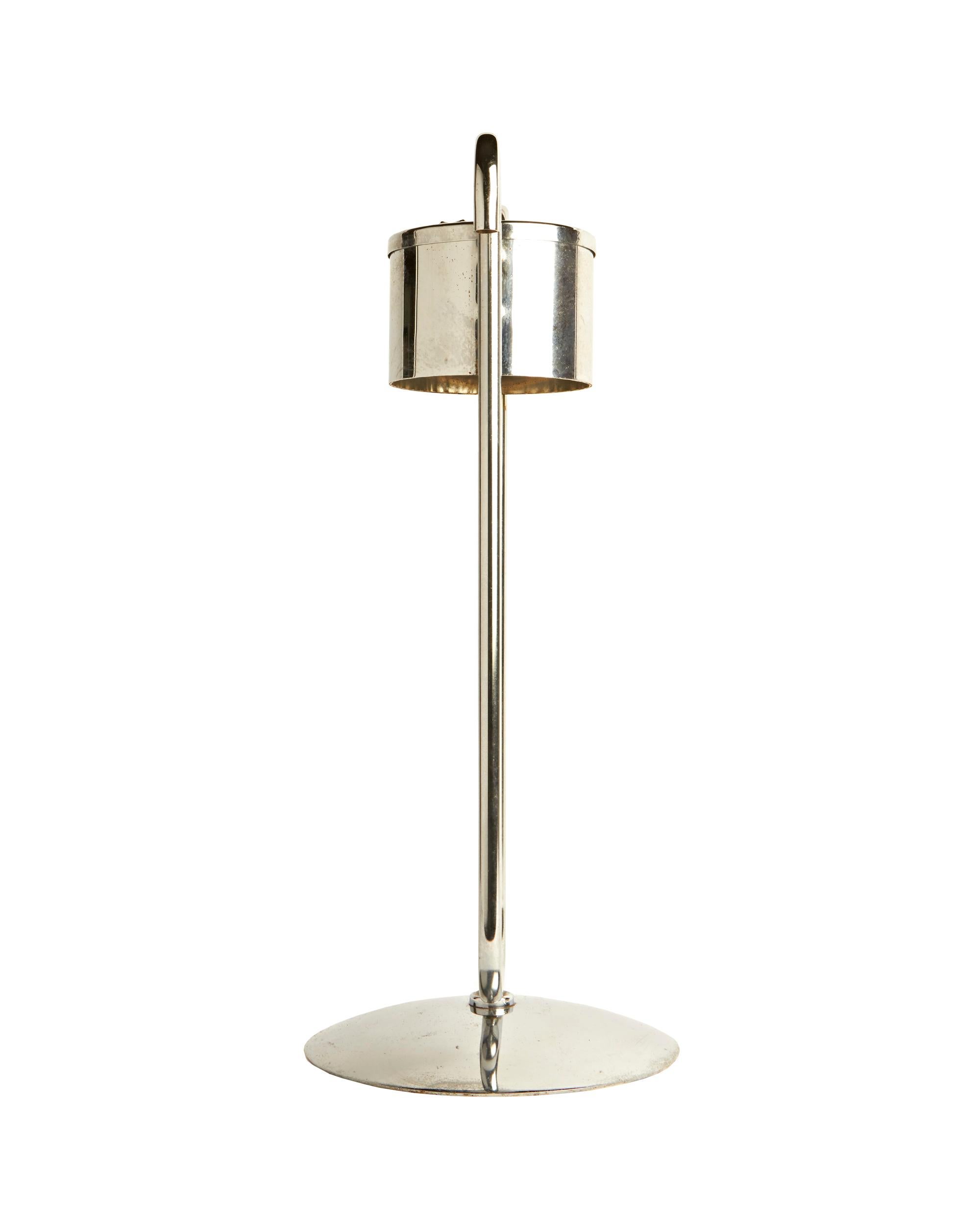 This very elegant American Art Deco chrome floor-standing ashtray was produced by Royalchrome (a trademark of the Royal Metal Manufacturing Company of Chicago) primarily for use in theatre or hotel lobbies. The spherical knop and the top opens the