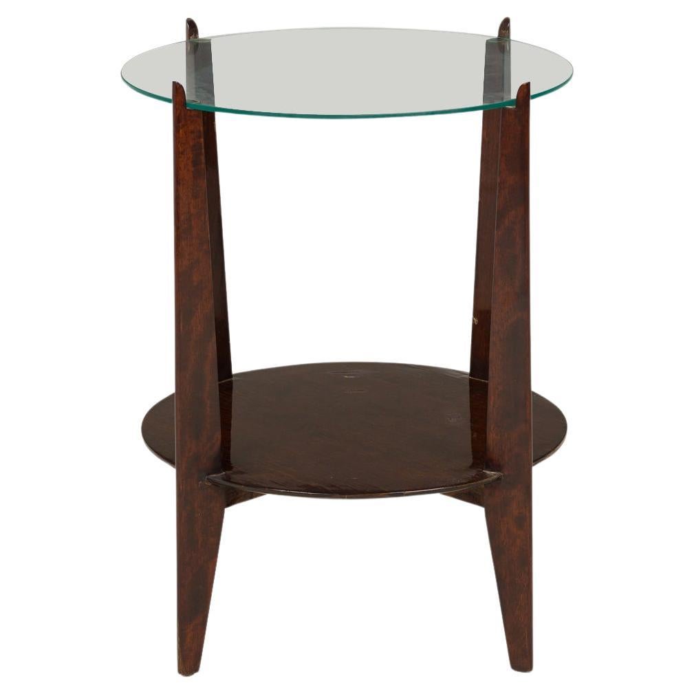 Mesa auxiliar de caoba lacada con tapa circular de cristal Art Decó americano