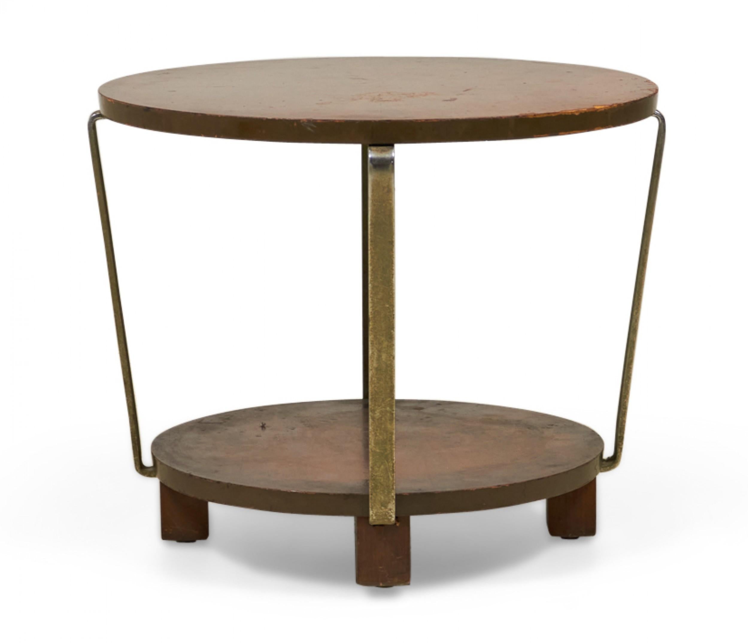 American Art Deco circular walnut table with four brass supports that angle inward to connect to a smaller bottom shelf resting on four square walnut feet.
