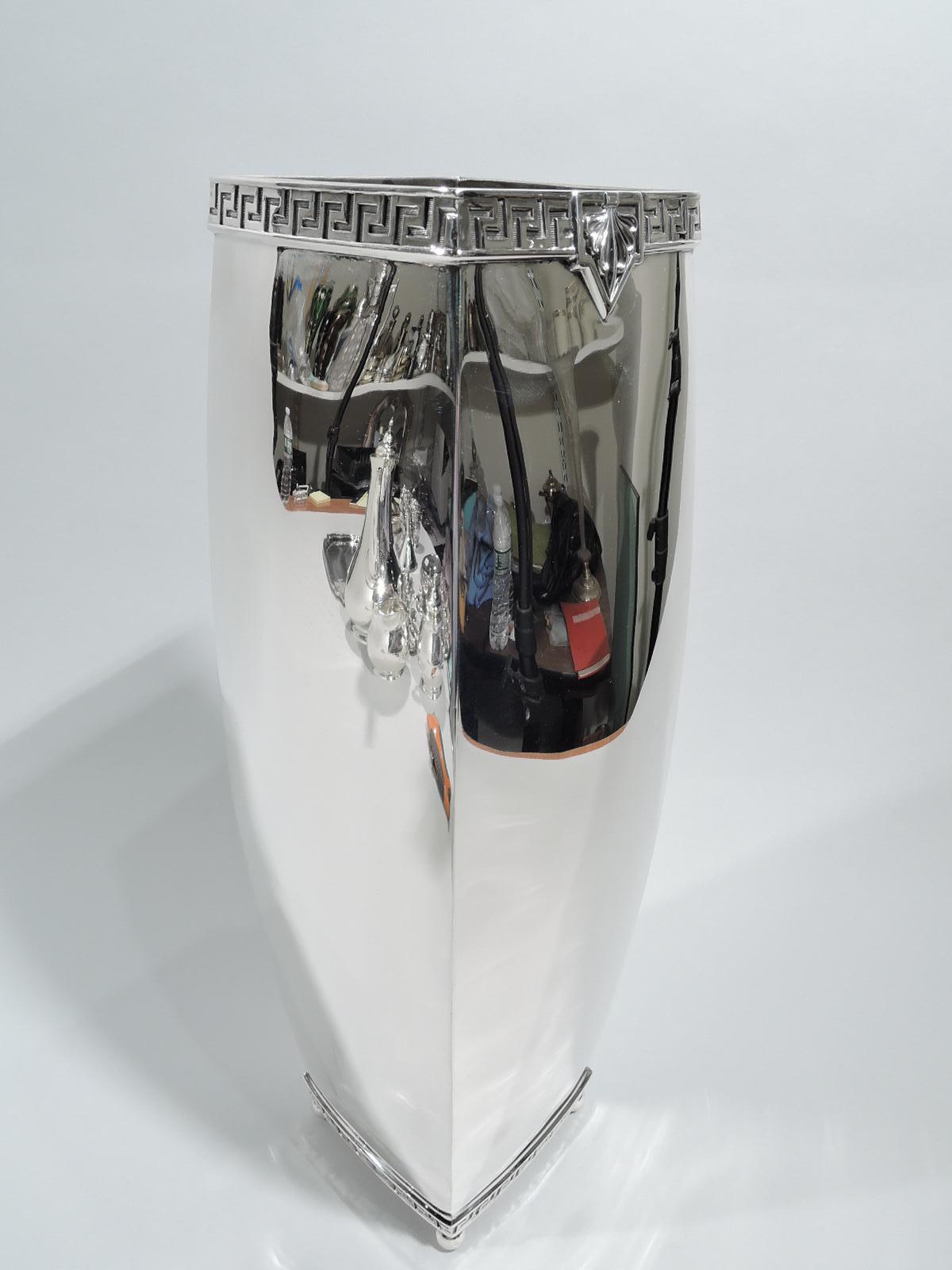 Art Deco Classical sterling silver vase. Made by Meriden Britannia (part of International) in Connecticut, ca 1920. Four curved sides with crisp corners and corner ball supports. Applied fretwork borders on lined ground at rim and base. Fully marked