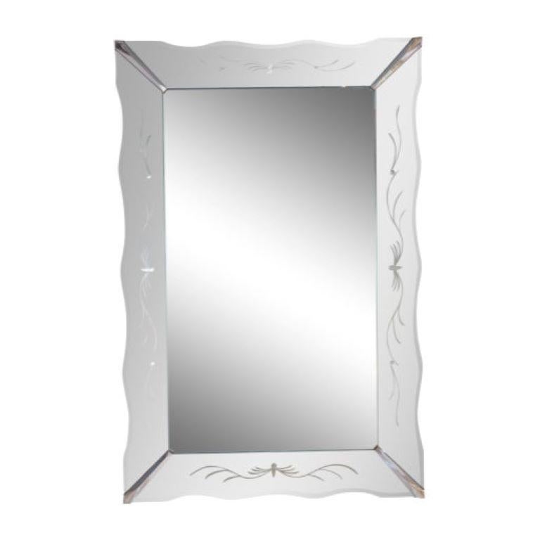 This large scale American Art Deco, framless, picture-frame style wall mirror has an etched detail and polished chrome hardware. The mirror has a soft, steel- blue coloration to it.