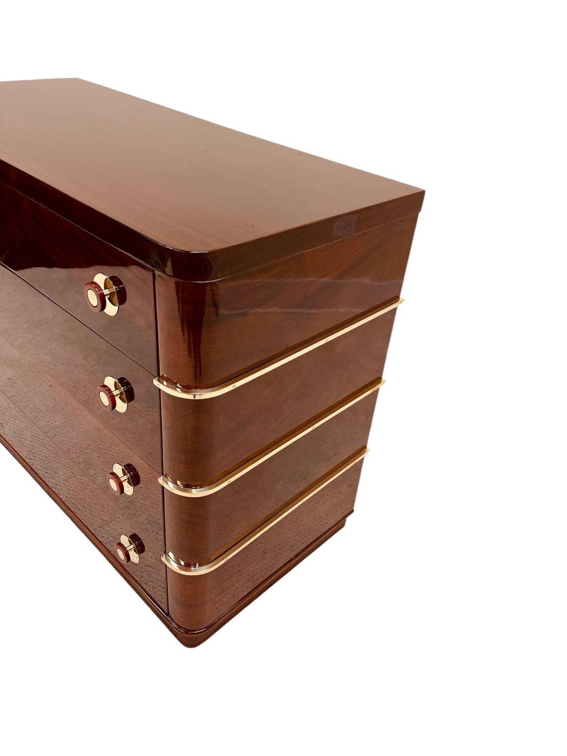 Mid-20th Century American Art Deco Flame Mahogany Commode With Bakelite And Brass Hardware C.1930