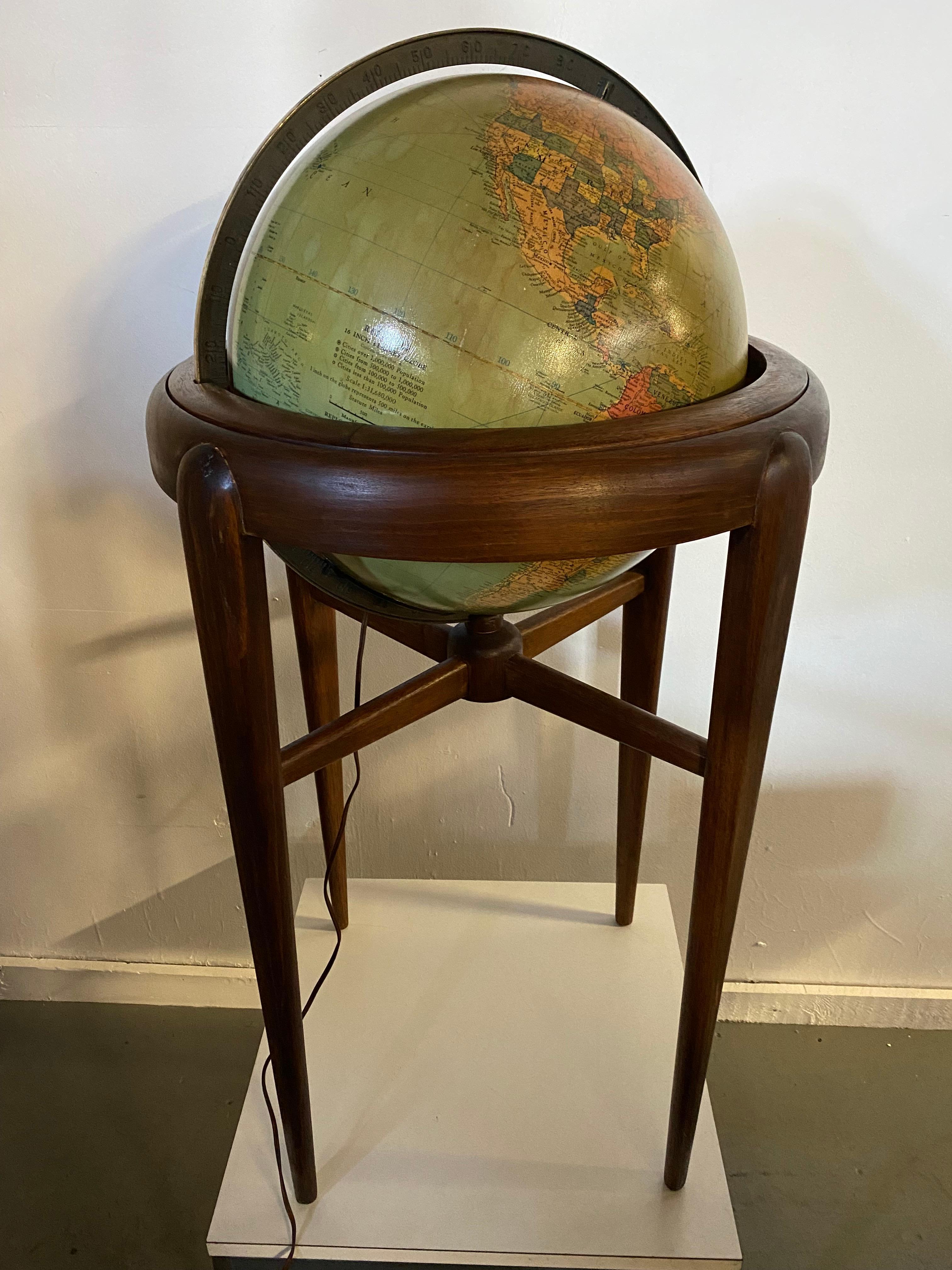 American Art Deco (Pre-WWII) globe of the world with an internal light resting in walnut wood stand (made by Replogle Globes, INC, Chicago, IL). Glass globe. Beautiful design. Tested and electrical working perfectly.