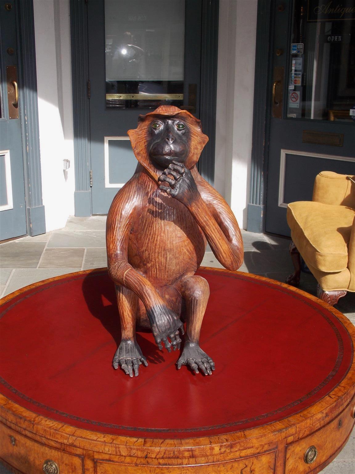 American Art Deco life-size leather monkey with the original green glass eyes, 20th century.