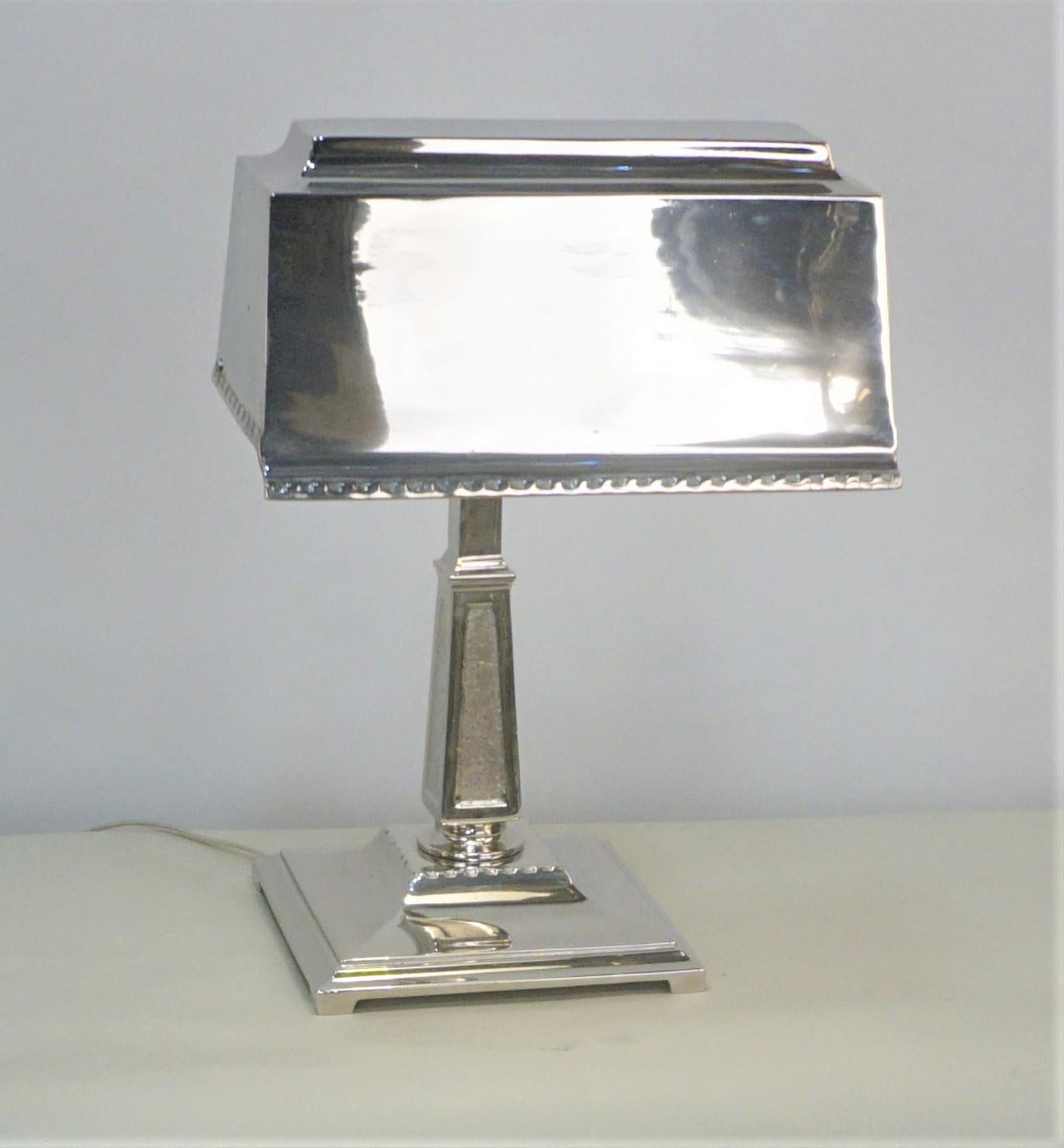 Beautiful high-quality polished nickel on cast bronze desk lamp with under the shade magnifying glass lens.
 This polished nickel with no oxidation, black spots are reflections not oxidation.