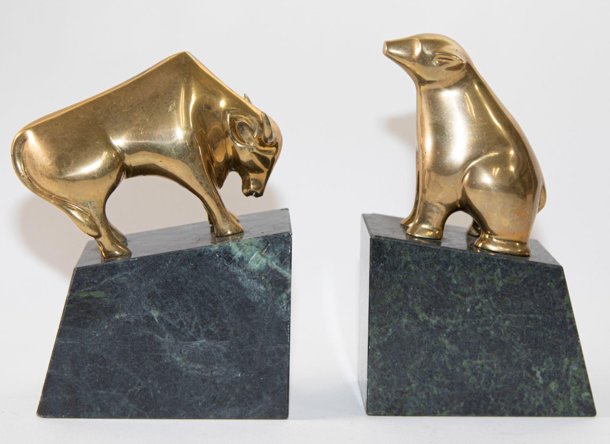 American Art Deco Polished Brass Bull and Bear Bookends Paperweights 1950s.
Polished Brass Bull and Bear Bookends Paperweights.
Vintage American Art Deco style brass bull and bear bookends, paperweights.
These stunning vintage Wall Street bull and