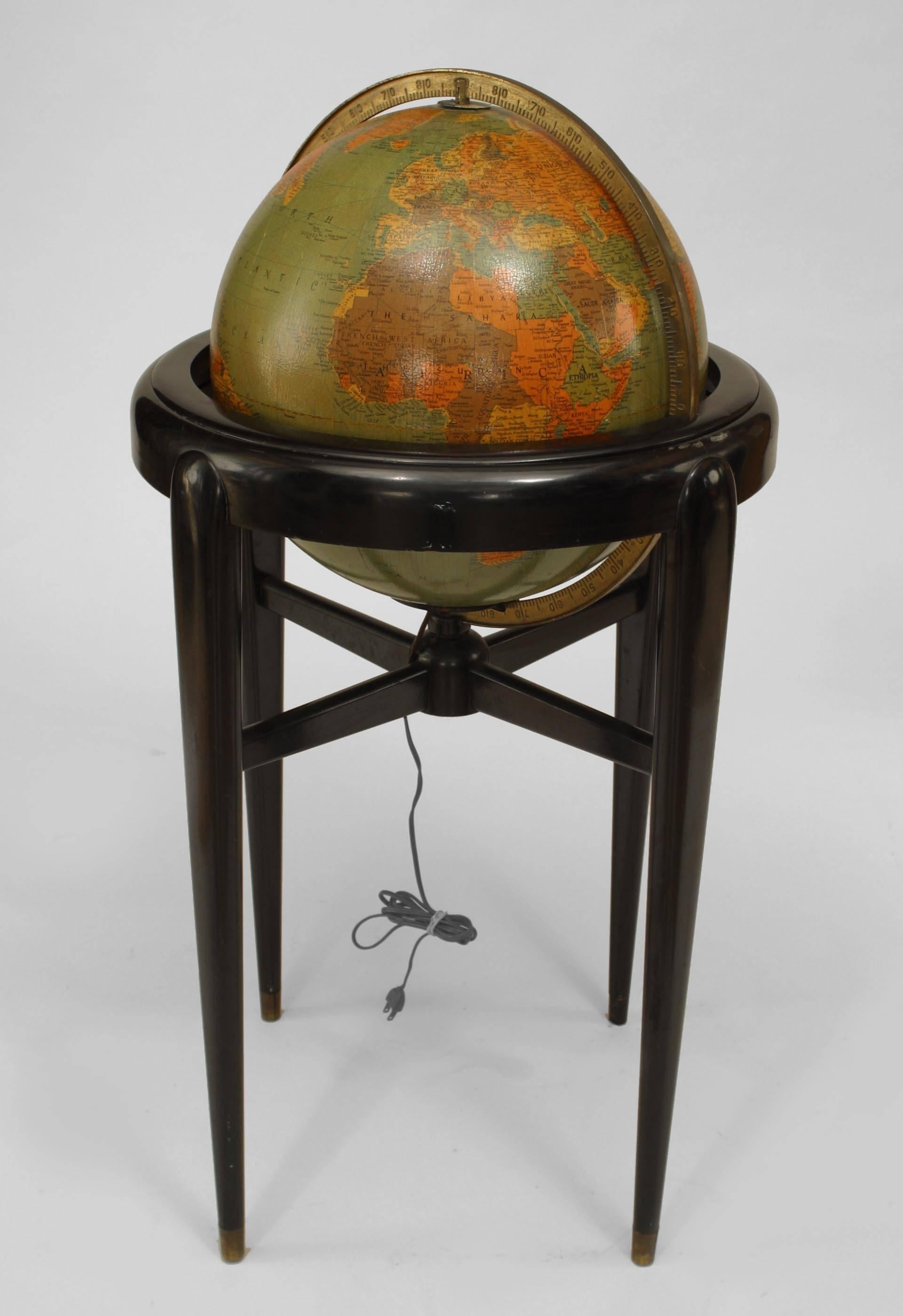 American Art Deco (Pre-WWII) globe of the world with an internal light resting in an ebonized wood Stand (made by Replogle Globes, INC, Chicago, IL).