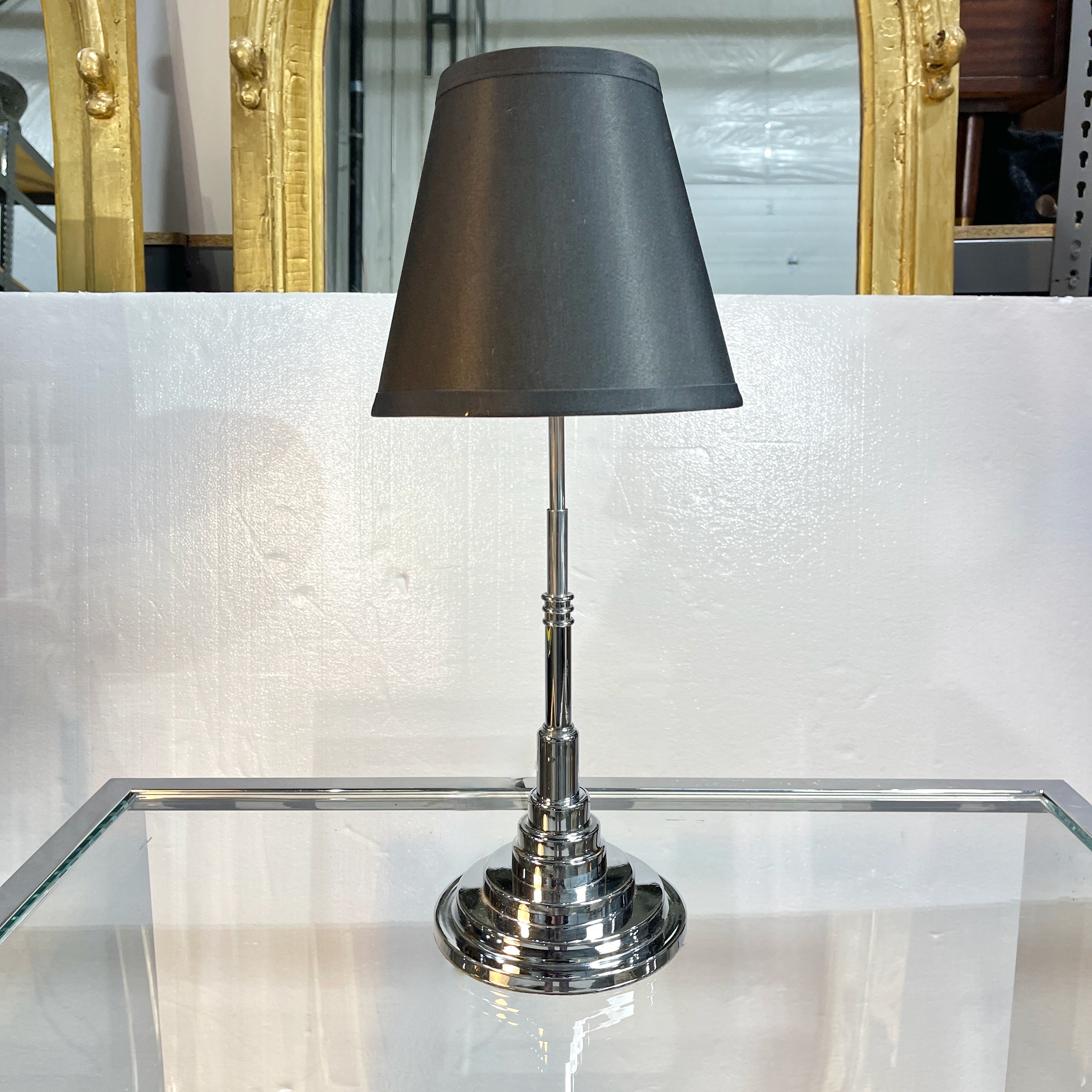 American art deco stepped chrome table lamp including black lamp shade.
19 inches high to top of shade.
17 inches high to top of bulb socket.
6 inch diameter base.