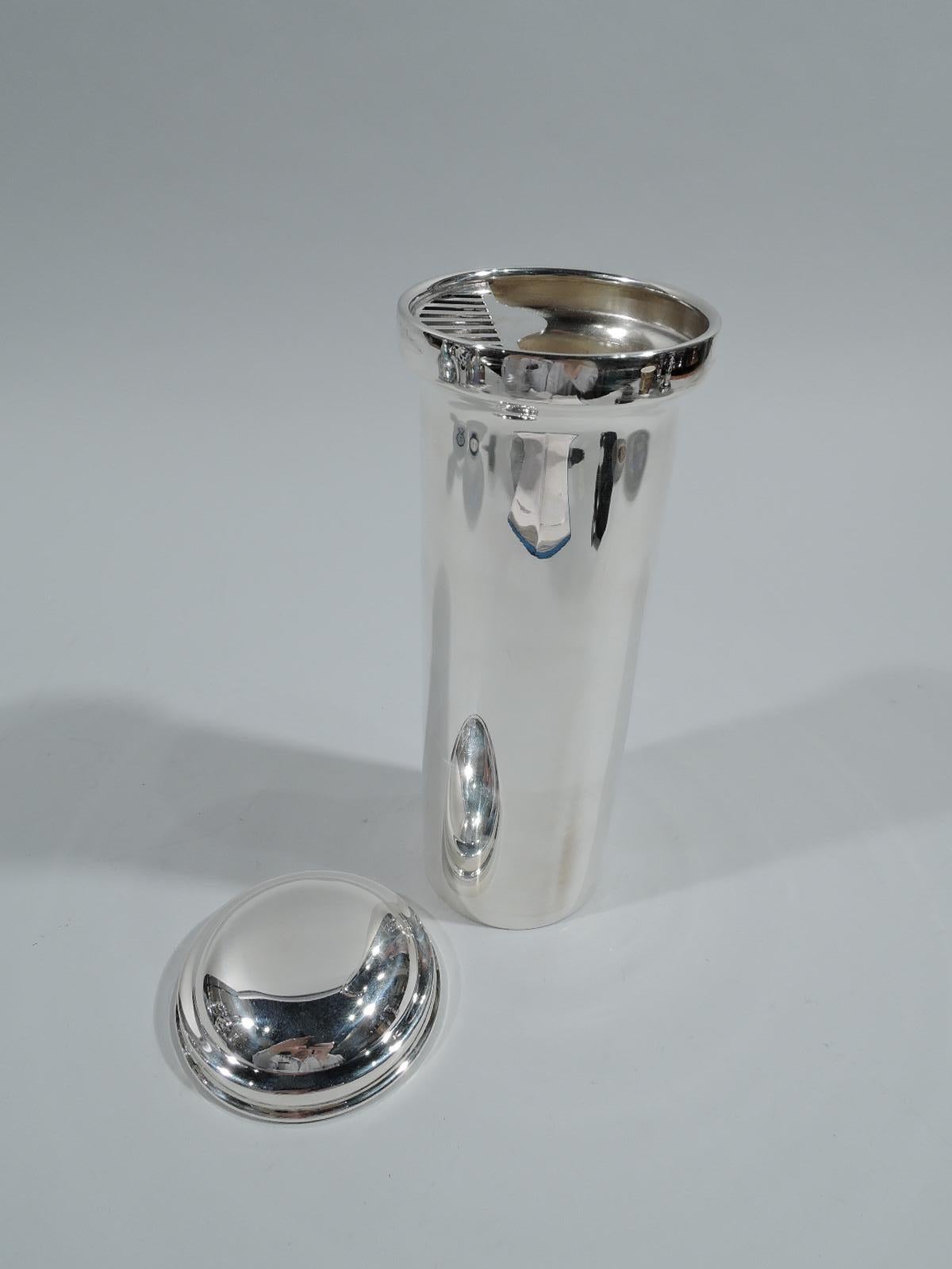 Art Deco sterling silver cocktail shaker. Made by LG Balfour Co. in Attleboro, Mass., ca 1925. Tall cylinder with built-in strainer. Snug-fitting domed cover. A spare ornament-free vessel for functional fun. Fully marked including maker’s stamp and