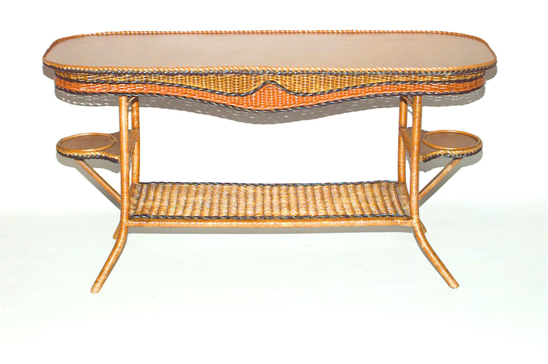American Art Deco natural wicker rectangular davenport table with black & orange trim with 2 side shelves and 1 bottom shelf.