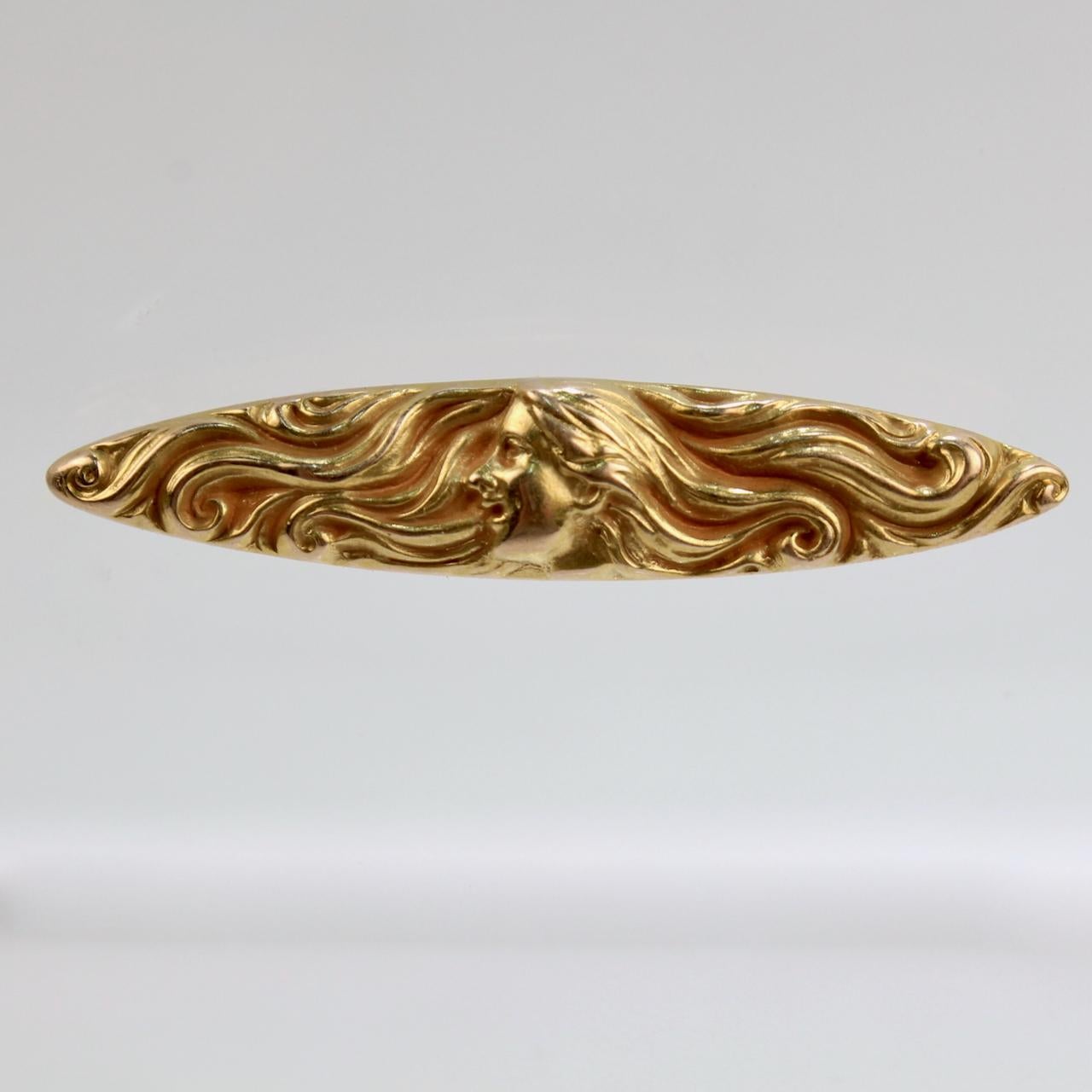 A fine American Art Nouveau brooch or pin by Kirby.

Of horizontal lozenge form with a finely worked repousse depiction of a woman's head and face in profile set in a field of her hair.

Fine work from a fine American maker!

Date:
Early 20th