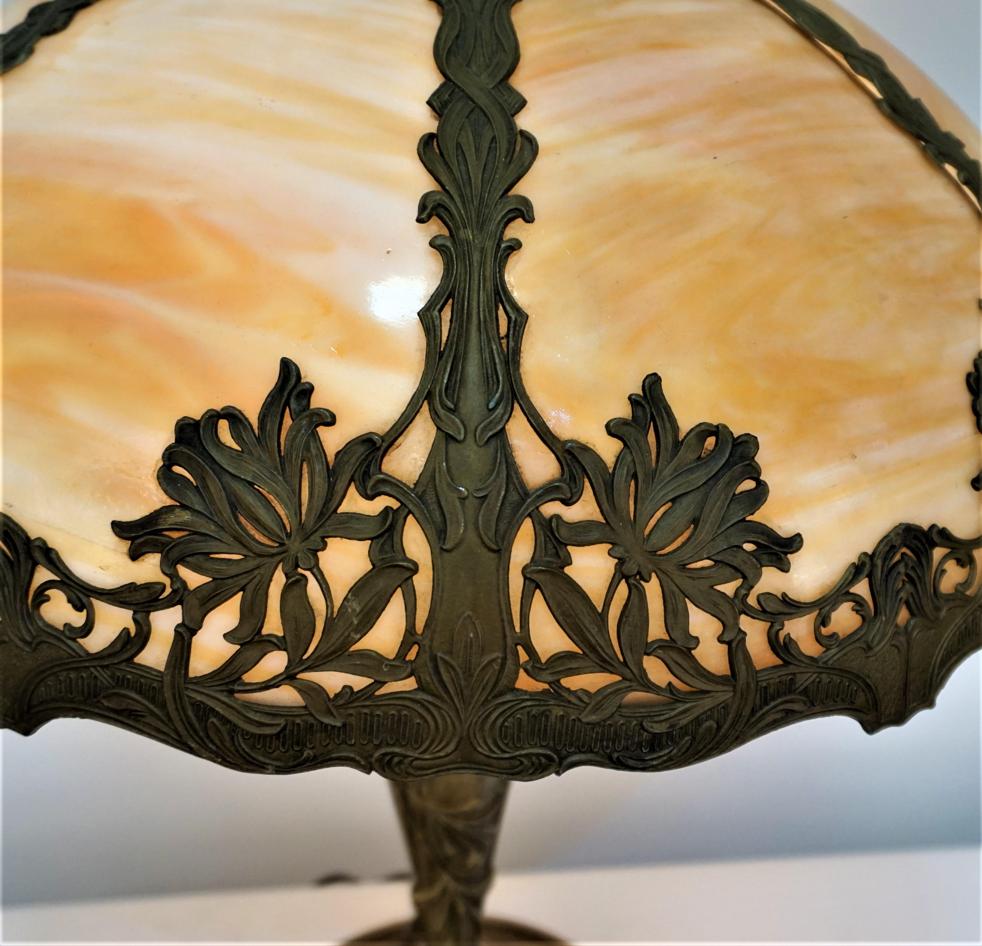 Beautiful early 20th century American art nouveau slag glass domed shape table lamp.