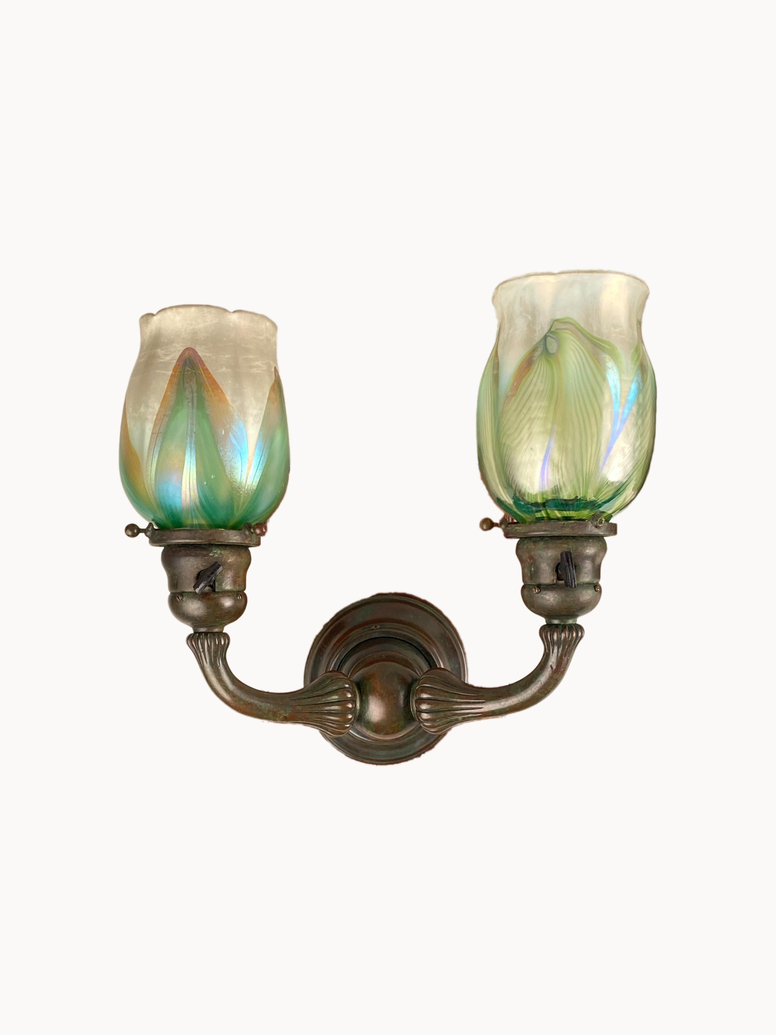 A fine pair of American Art Nouveau cast bronze and glass Tiffany Studios 