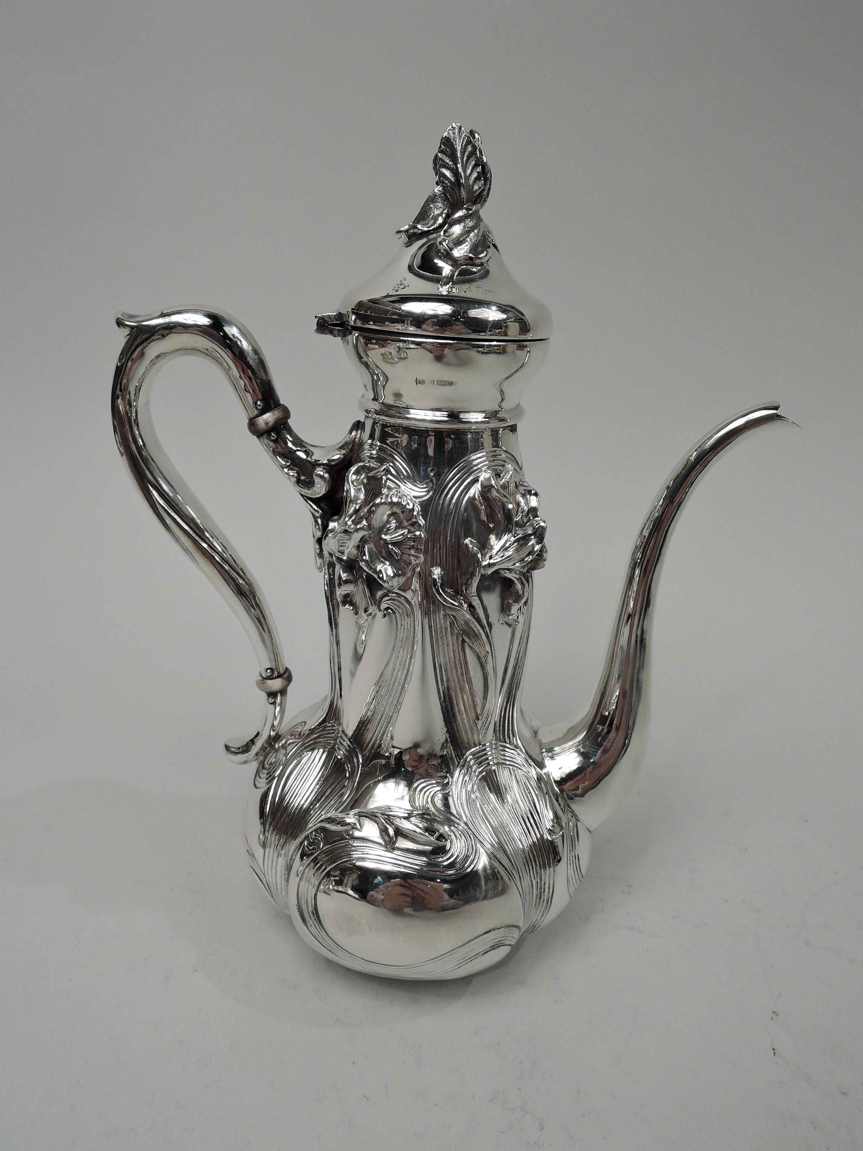 Art Nouveau sterling silver coffee set. Made by William B. Kerr & Co. in New York, ca 1890. This set comprises 3 pieces: Coffeepot, creamer, and sugar. Each: Lobed and globular body. Handles capped and high-looping. Coffeepot has hinged and domed