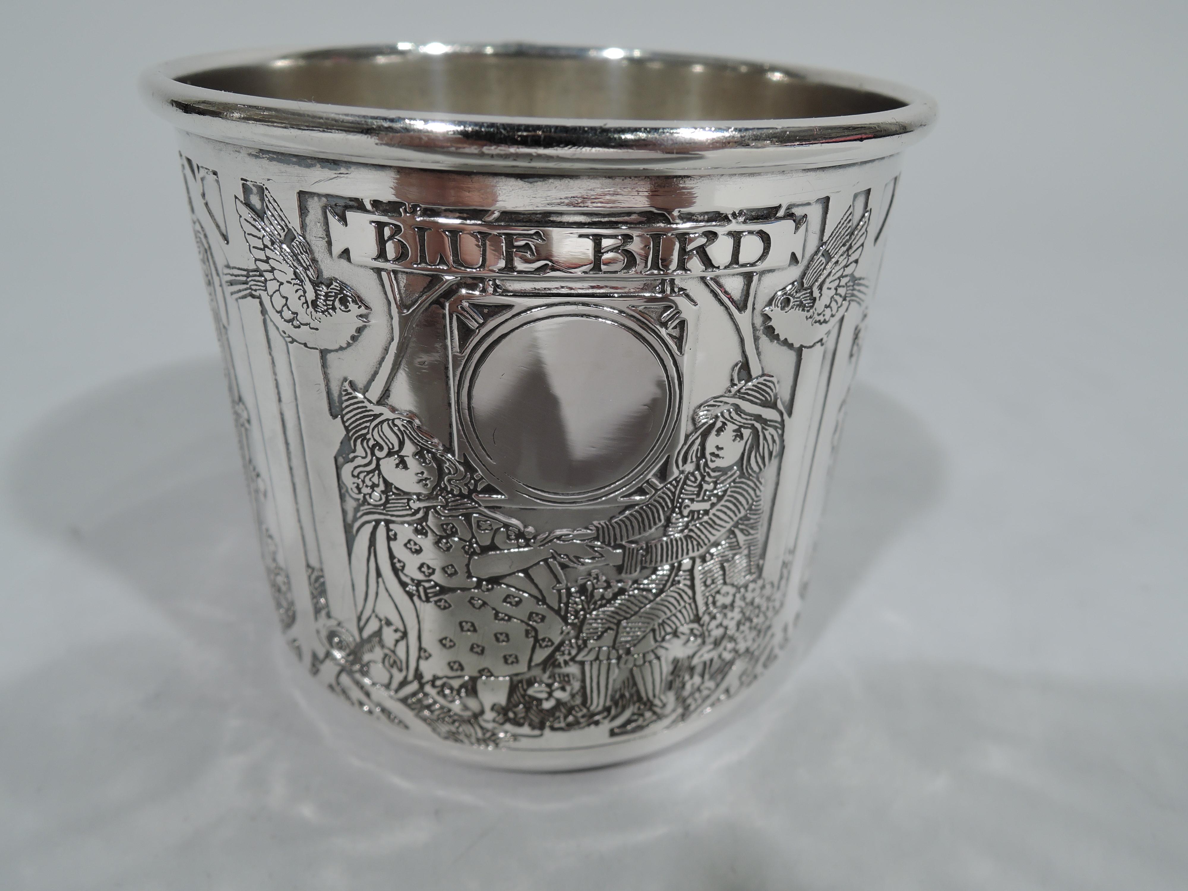 Art Nouveau sterling silver baby cup. Made by Kerr in Newark. Straight sides and bracket handle. Acid-etched fairy tale witches and maidens. The elongated figures stoop and bend in frames delineated by sinister tree trunks. Hallmark includes no.