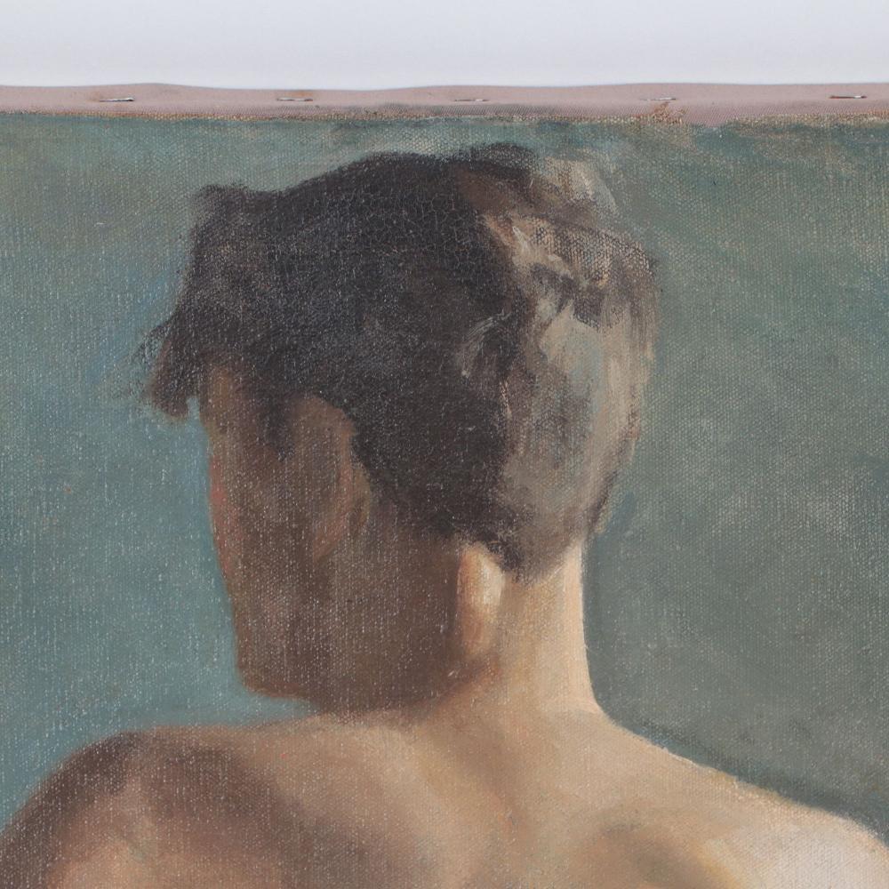 This painting features a nude male with his lissome back to the viewer as he lounges against the end of a fabric draped bed (or other piece of furniture) inside a studio. The subtle shadows add to the enigmatic nature of the painting while his body