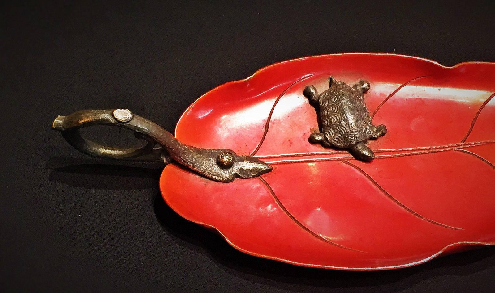 This beautiful terracotta-color lacquered brass jewelry tray in the form of a leaf is tastefully embellished with a patinated bronze handle in form of a branch and a miniature turtle and a fly.