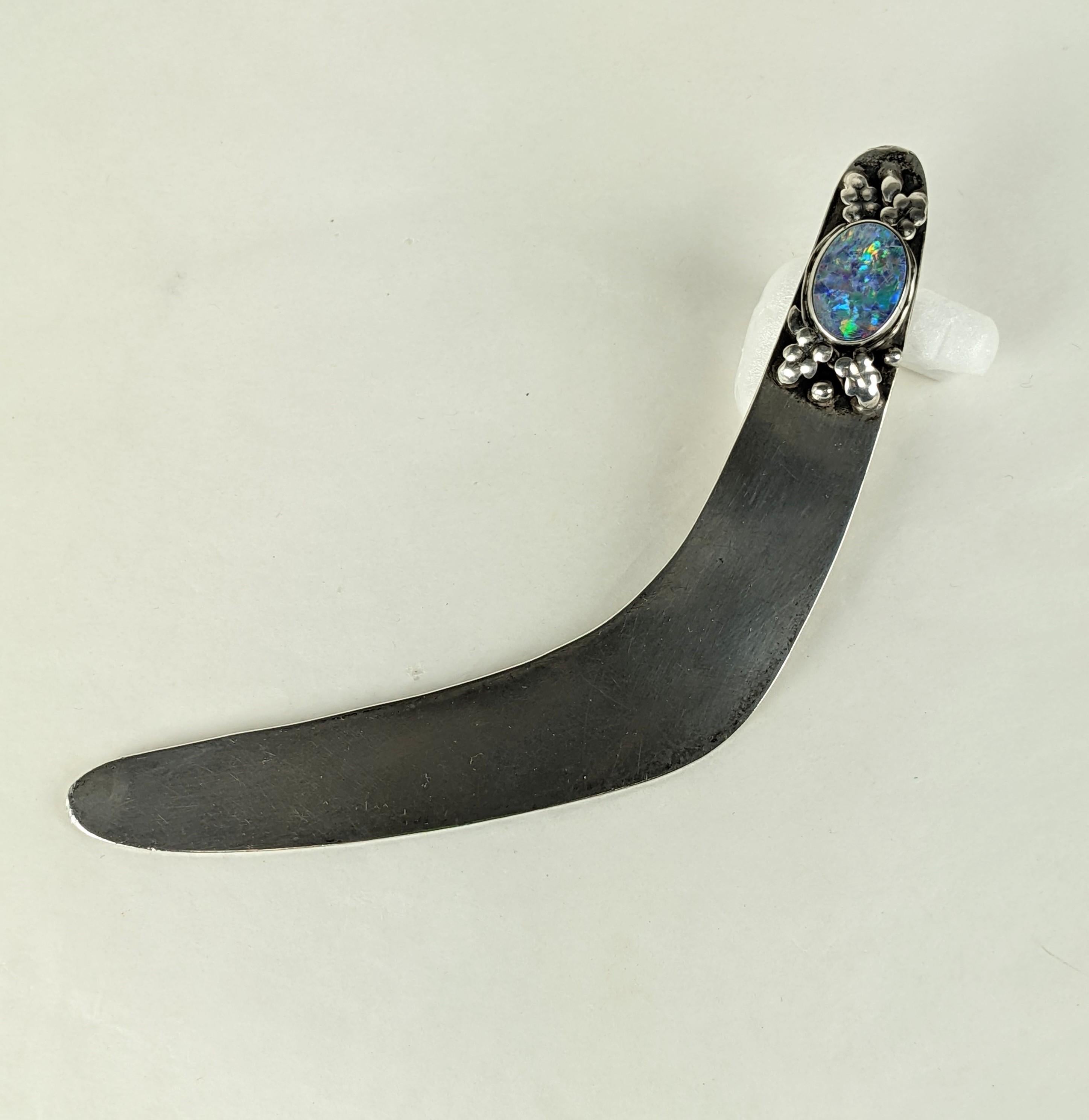American Arts and Crafts Sterling and Opal Letter Opener circa 1910. Unknown craftsman with fine jeweler's skills. Hand made with oval bezel set peacock opal 
 surrounded by hand raised leaves and silver shot work, all set on a boomerang shaped