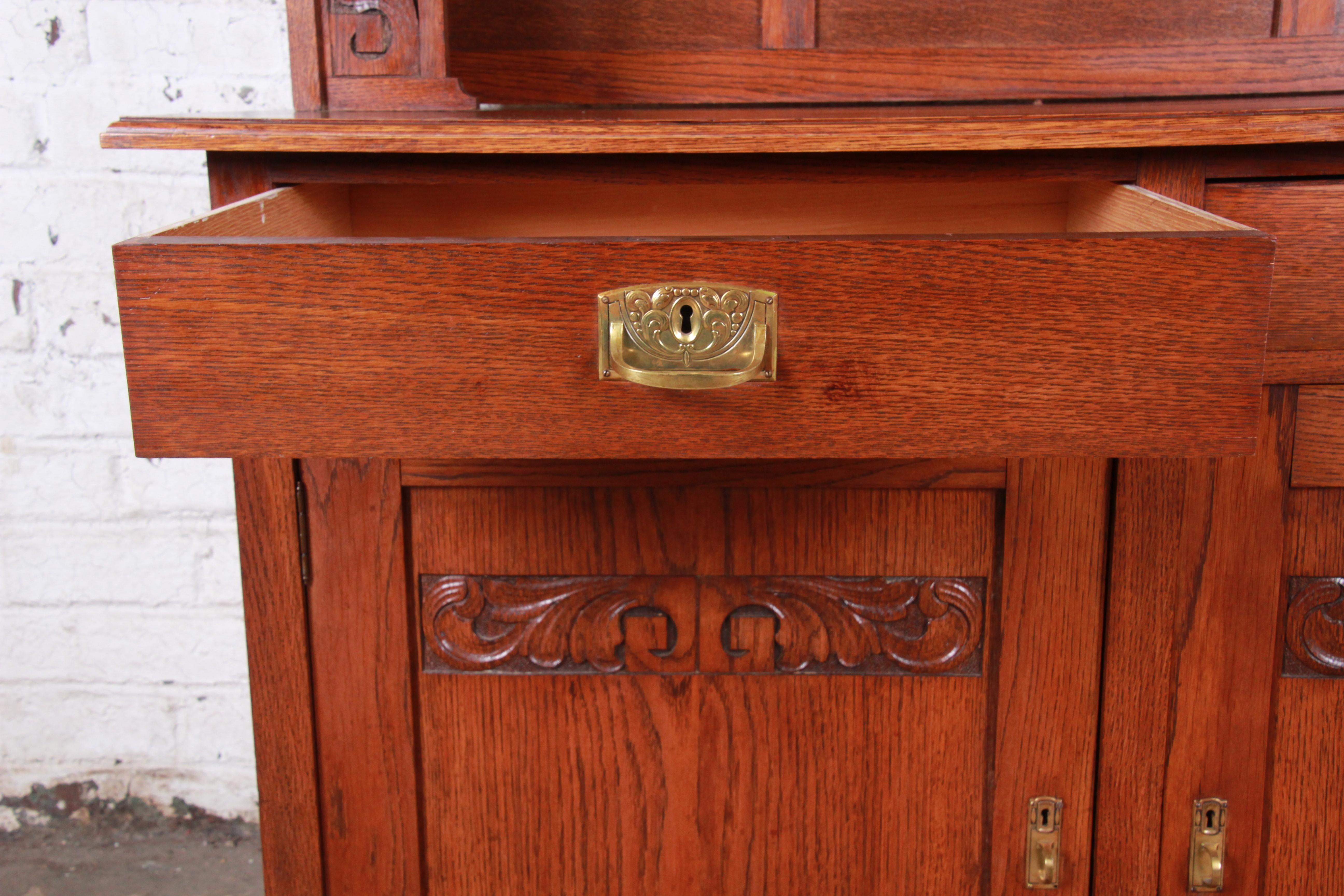 Brass American Arts & Crafts Carved Oak Sideboard with Hutch