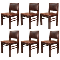 American Chairs in Oak with Cognac Colored Leatherette Seats