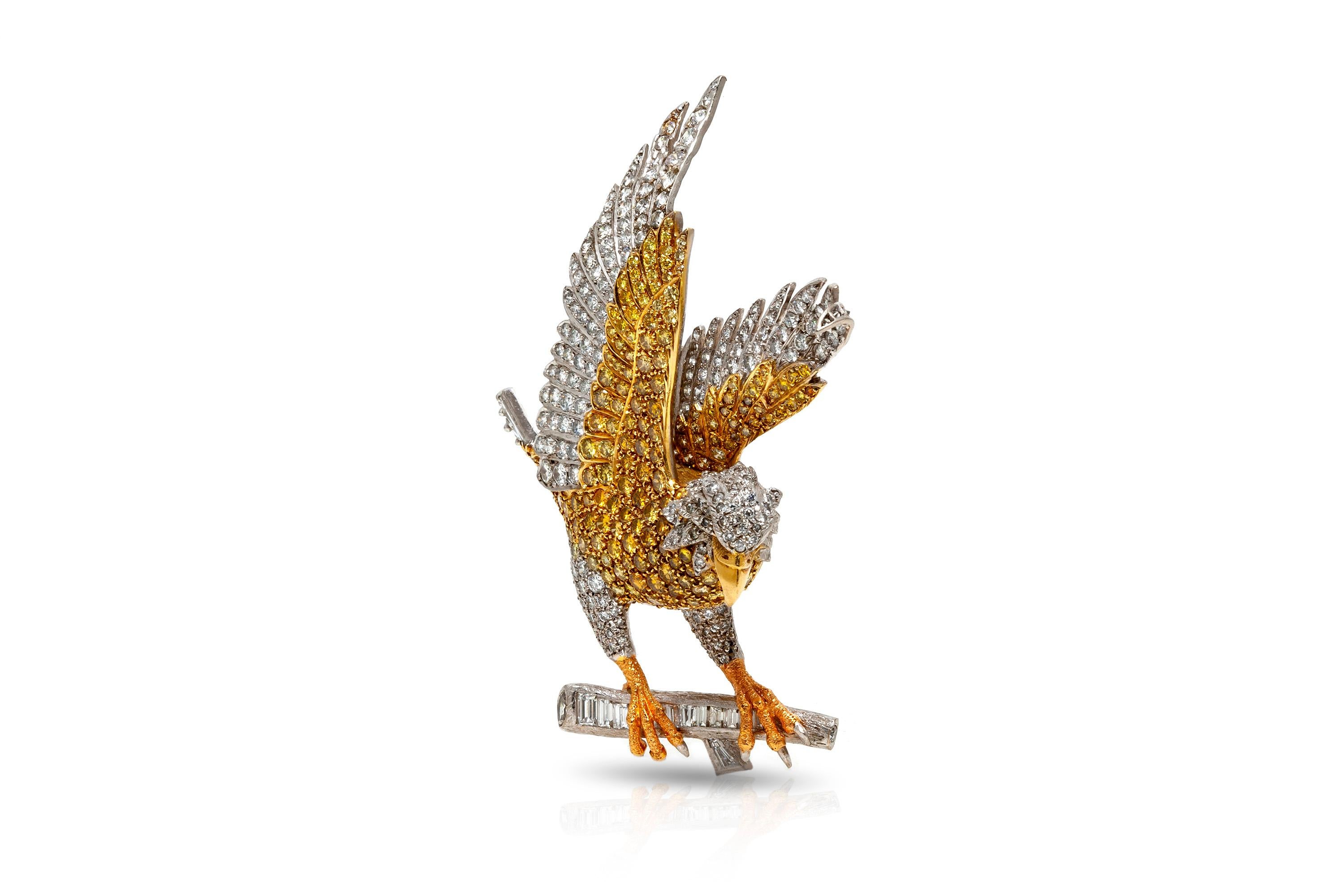 American eagle brooch, finely crafted in 18k yellow and white gold, featuring approximately a total of 11.00 carats of yellow diamonds and approximately a total of 10.00 carats of diamonds.