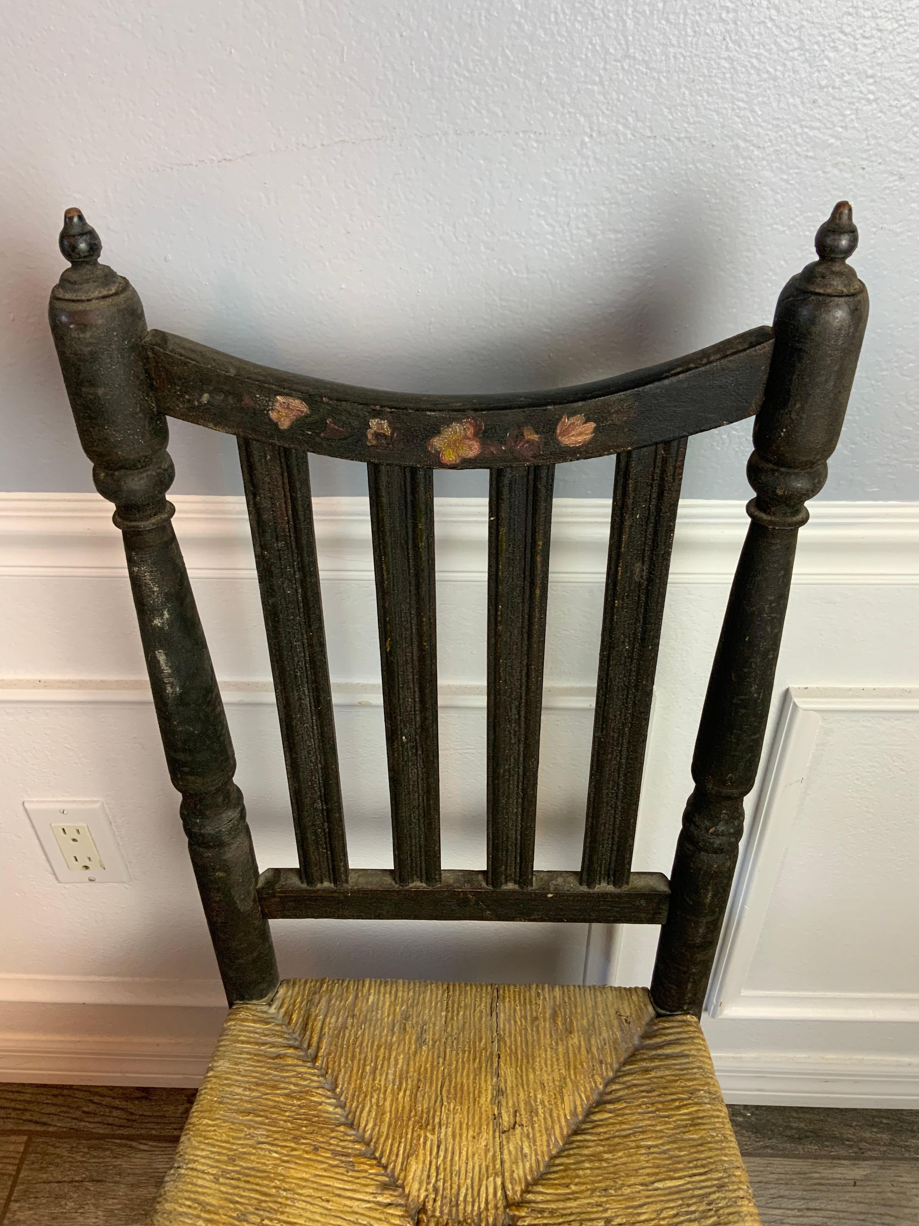 Nice example of an original condition Late 18th century American Banister yoke back chair with sausage style turned front rails probably New Jersey or New York 1750-1800. Original black paint decorated with floral designs under the old dry original