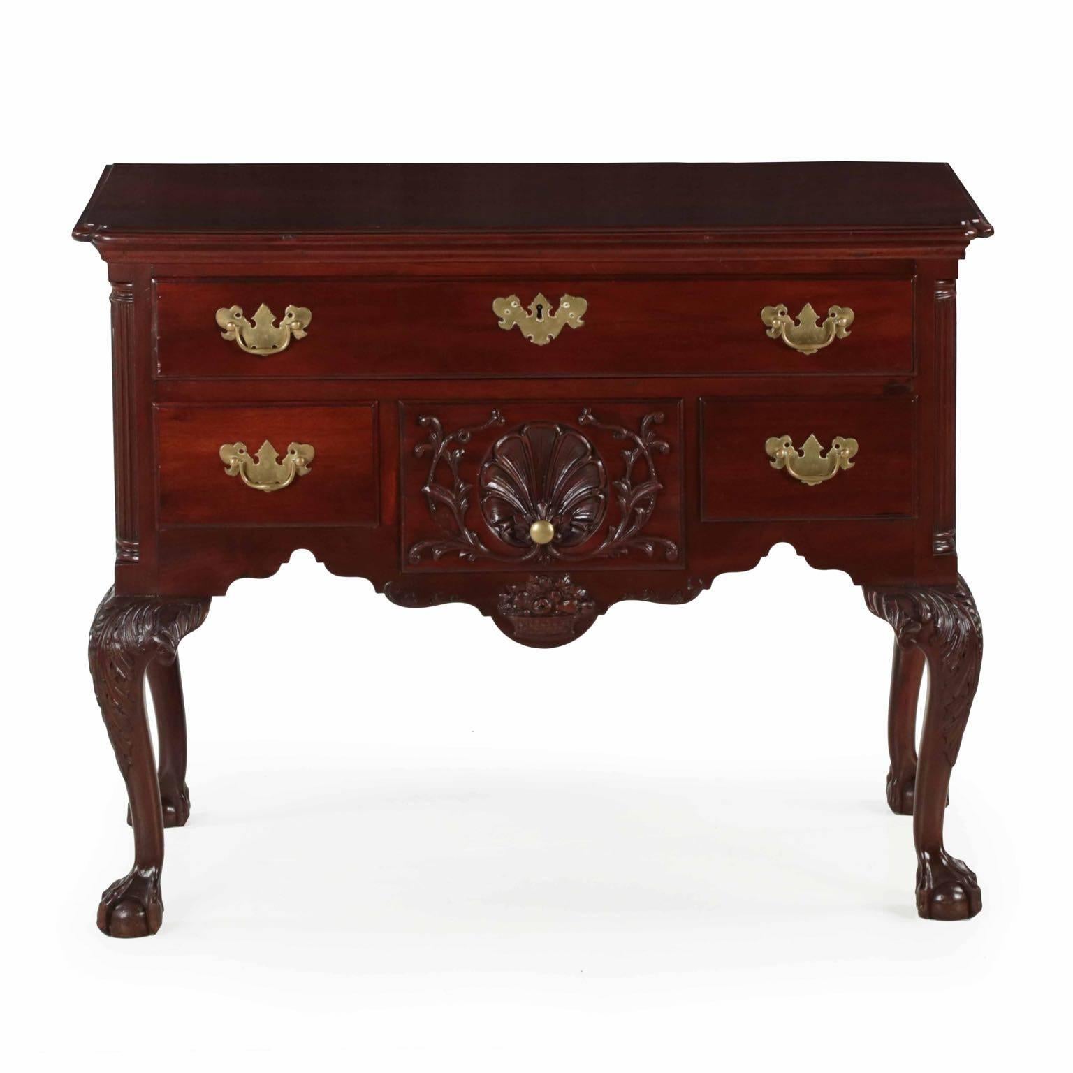 An attractive benchmade lowboy in the Chippendale style after the originals of Philadelphia, this example is probably crafted at the turn of the century. A nice dense Cuban mahogany is utilized throughout all of the primary surfaces, the secondaries