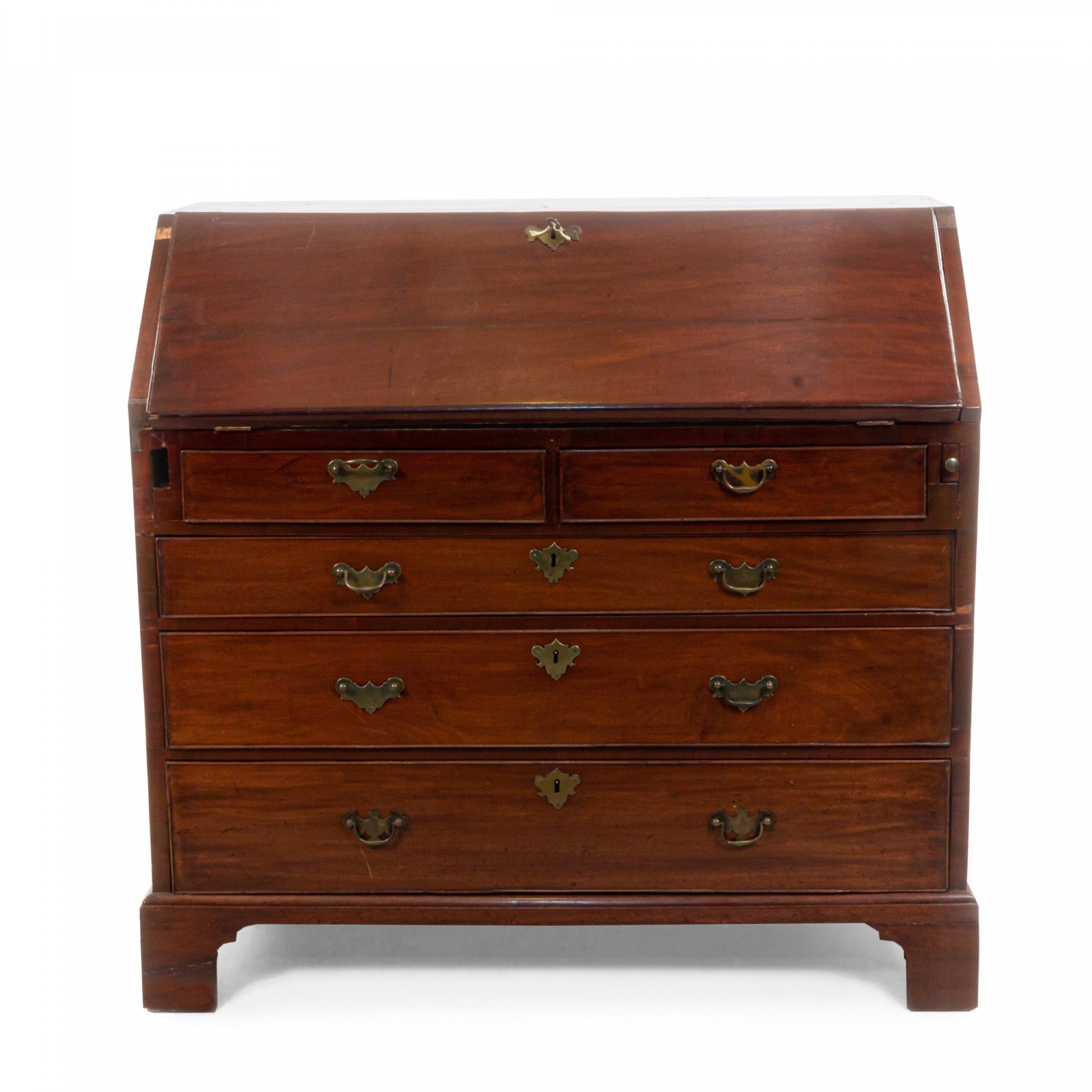 American 18th-19th century block front mahogany secretary desk with a slant top drop front over 3 drawers supported on ogee bracket feet.