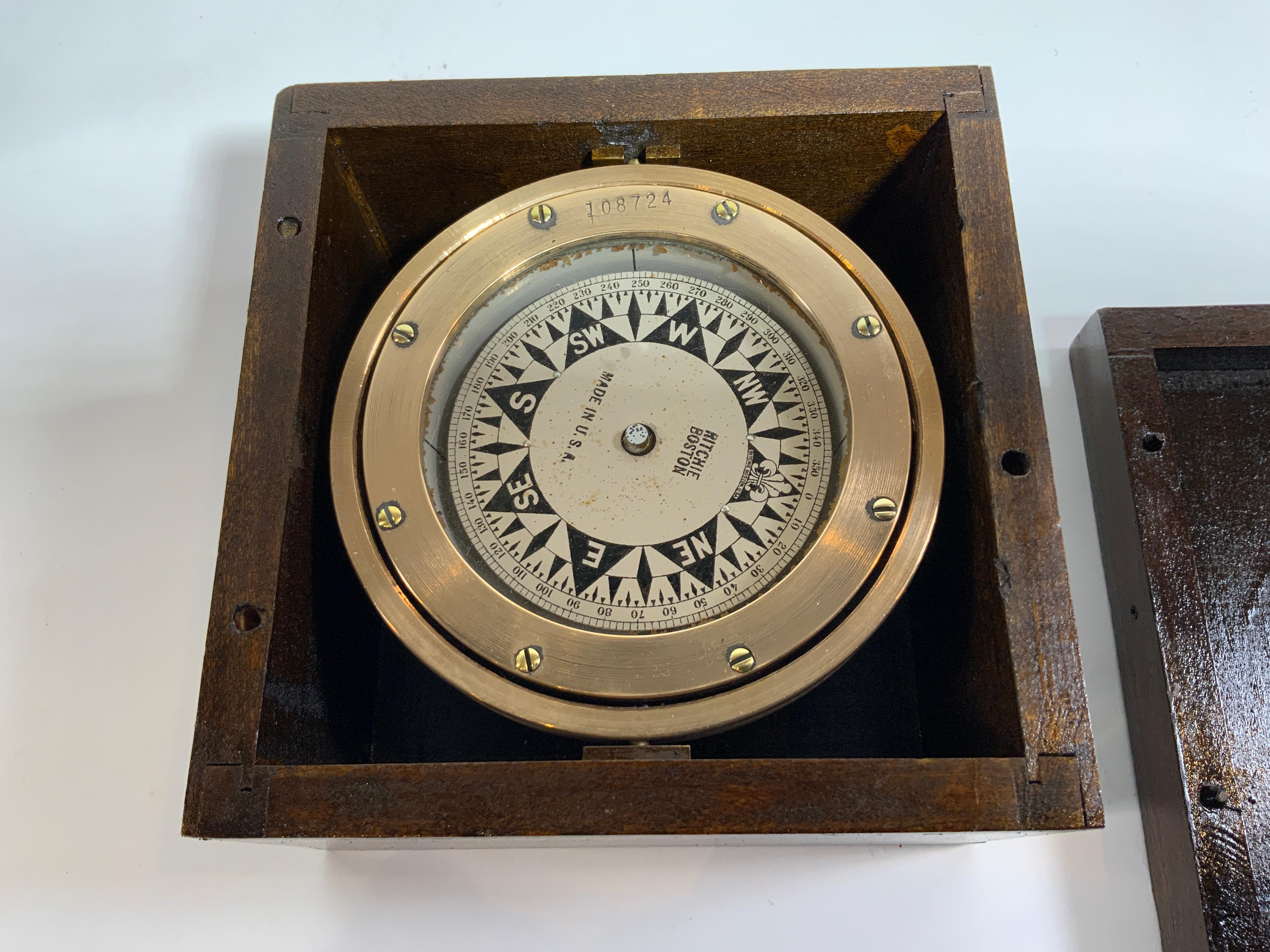 Solid brass gimballed boat box compass by Ritchie of Boston. Serial no. 108724. Oil filled compass. Brass is nicely polished. Fitted to a varnished box with lid. Circa 1930. 

Overall Dimensions: 6