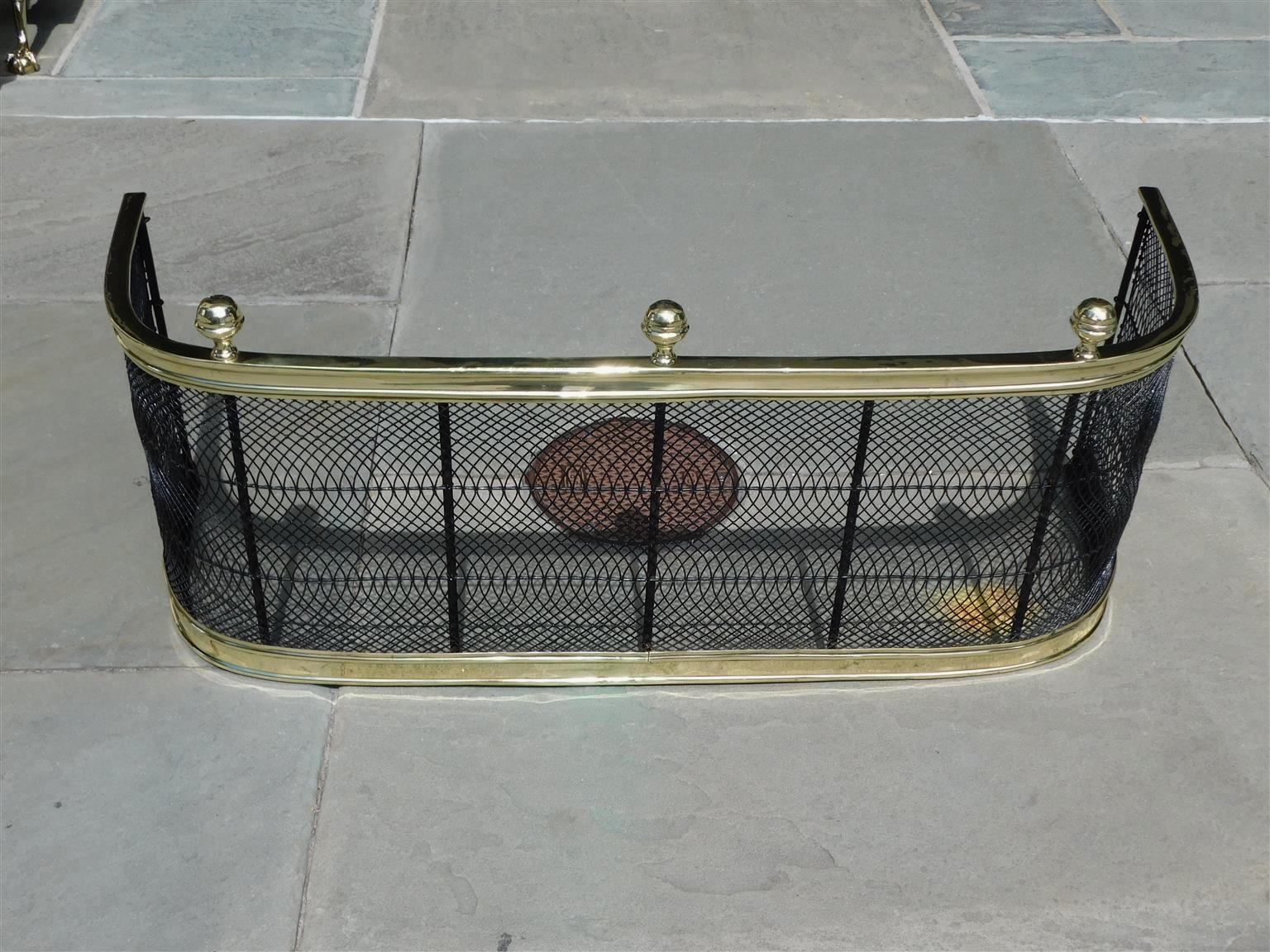 American brass and artistic wire work fire place fender with three flanking ball finials. Early 19th Century.