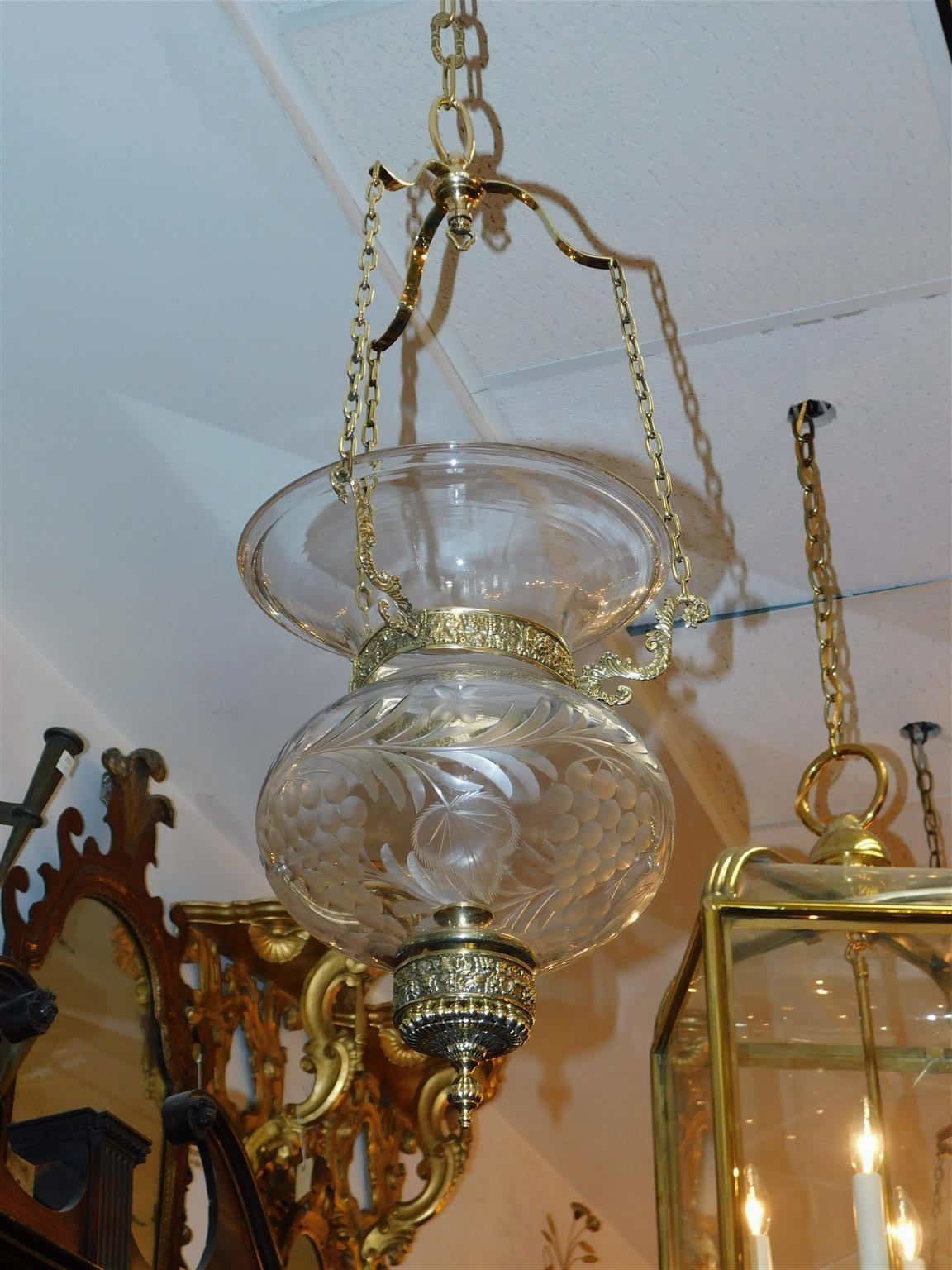 American brass and etched foliage glass globe hanging bell jar hall lantern with three decorative scrolled arms, grape vine motif, and finial bead work. Early 19th Century. Bell jar is candle powered but can be electrified if desired at no