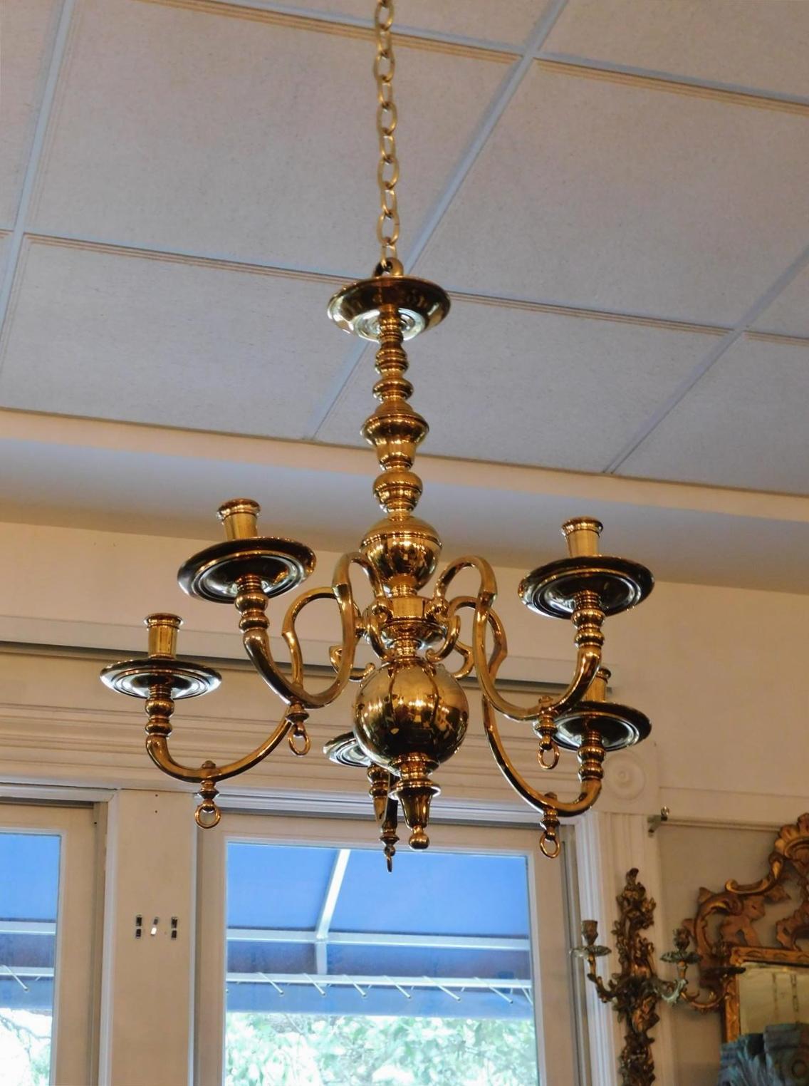 American brass scrolled five arm bulbous column chandelier with original cock keys, bobeches, and lower central ball with urn finial . Originally gas powered. Chandelier can be electrified if desired at no additional cost. Mid 19th Century.