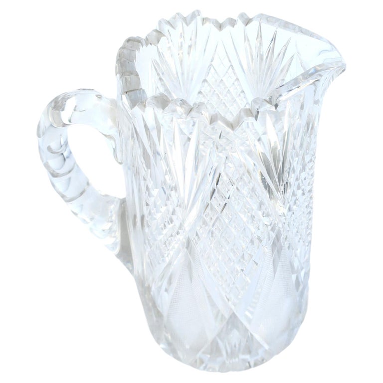 Small Glass Pitcher with a large heavy silver spout