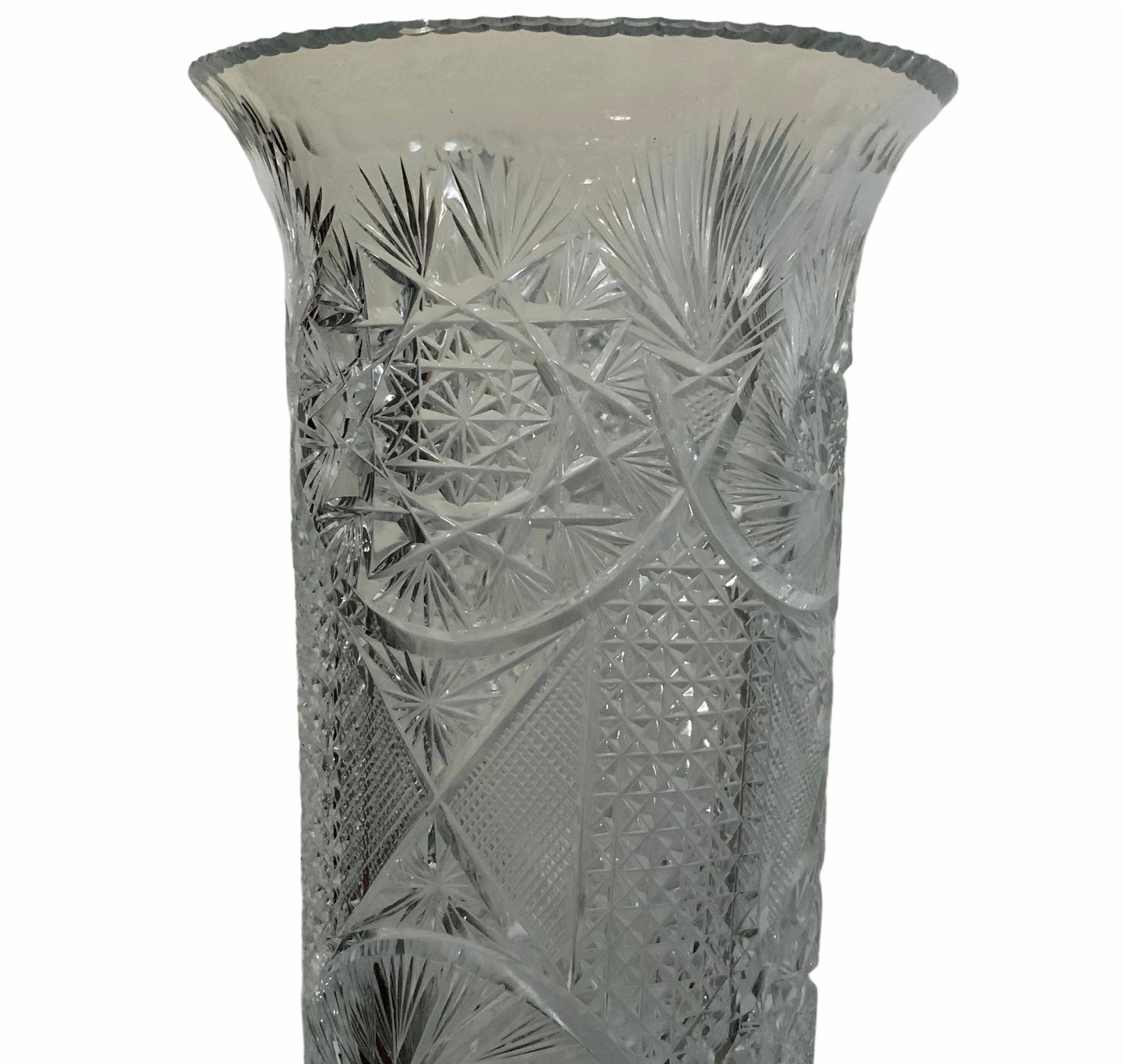 An American Brilliant cut clear glass large heavy umbrella/cane stand. It is cylindrical shaped and is adorned with different American Brilliant Glass motifs like large hobstars, buzz, stars, strawberry pattern, etc.