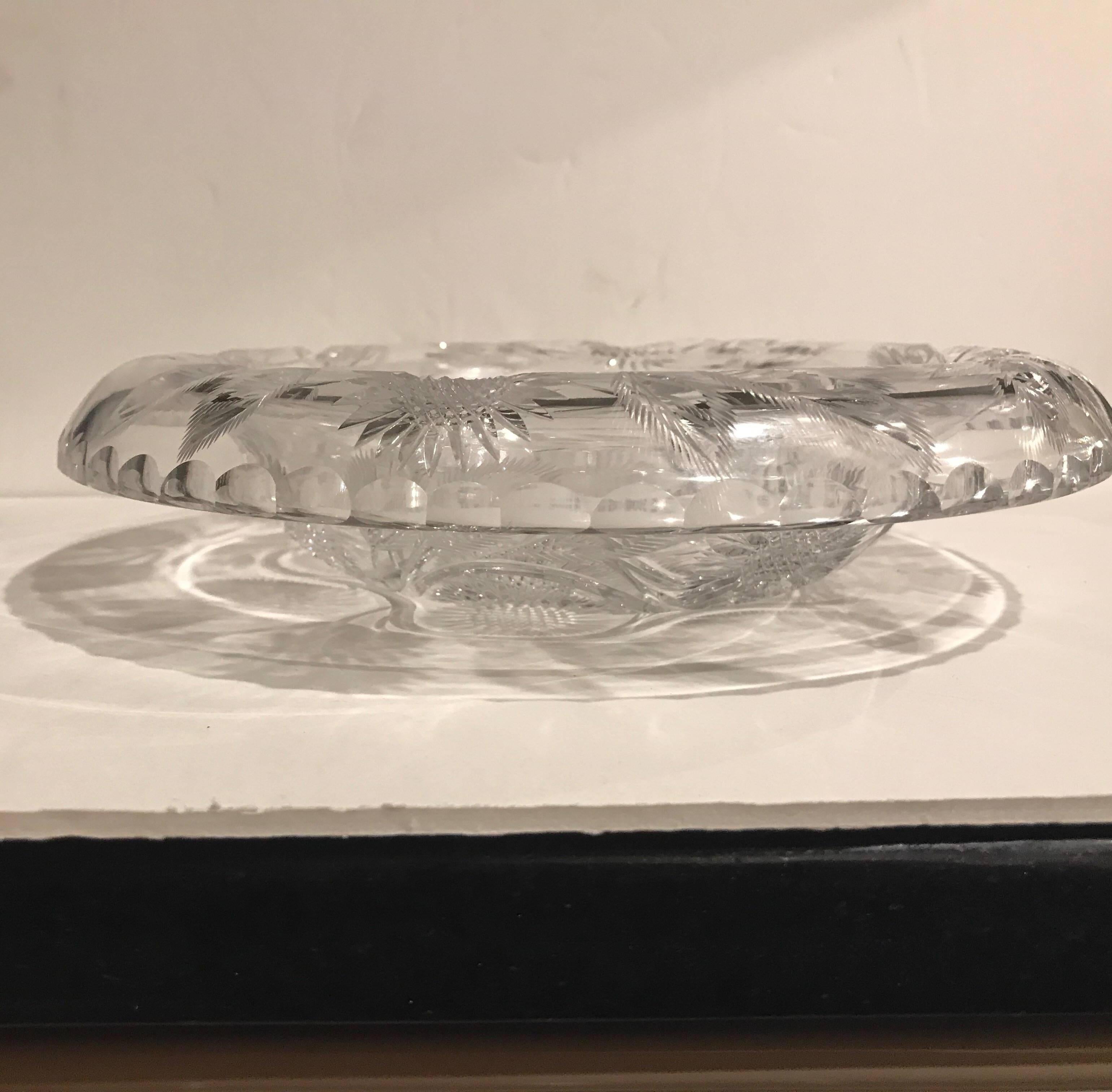 Stunning Intaglio cut-glass rolled edge bowl. The high mirror like deep and crisp cuts which are a classic American brilliant period quality, attributed to Clark. This piece is entirely hand-cut and polished by an expert glass cutter.