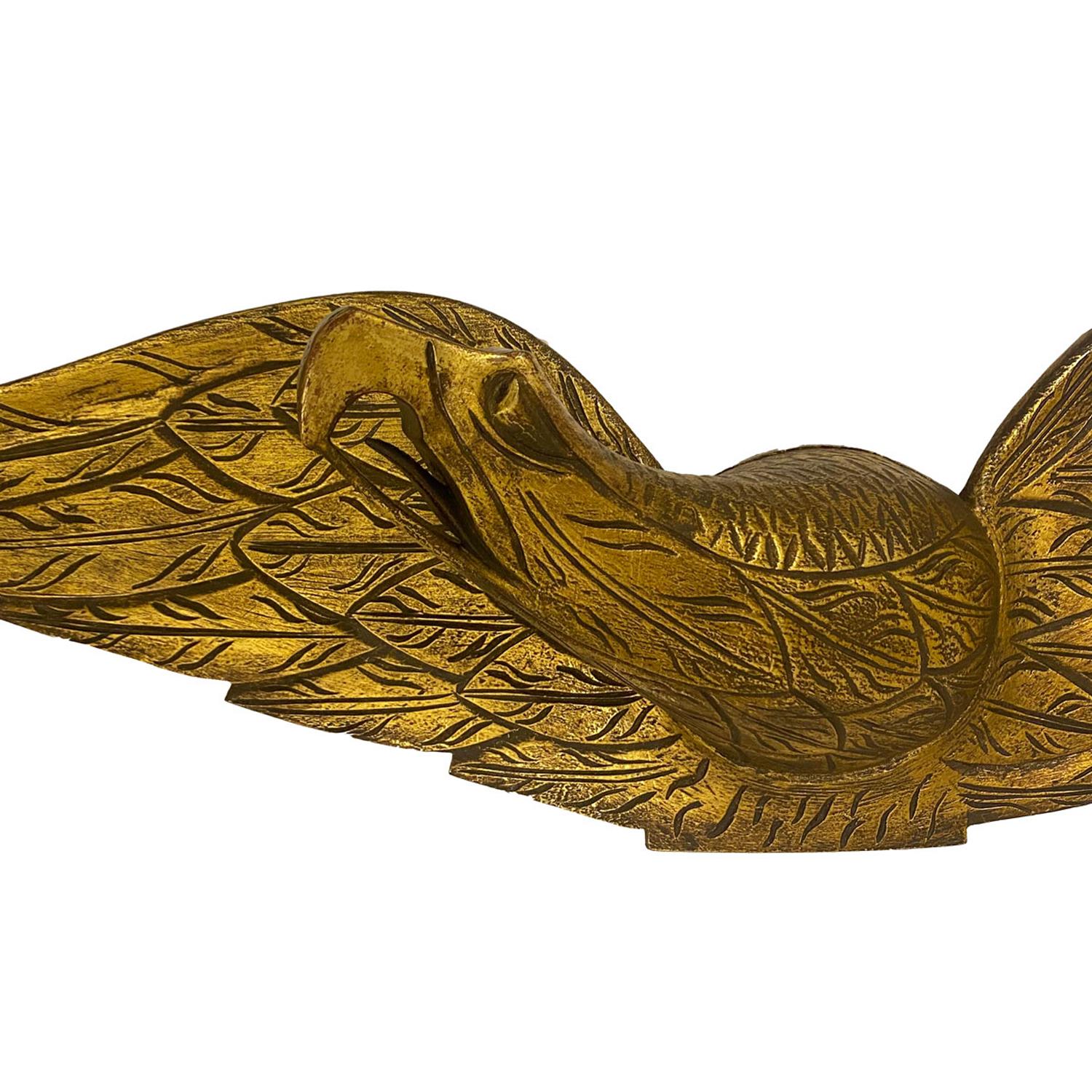 A very good Bellamy style carved and gilded spreadwing eagle, made from Pine, with two piece construction. These type of eagles were made popular by John H Bellamy (1836-1914), that were used decoratively for ships and homes.
With a warm gilded