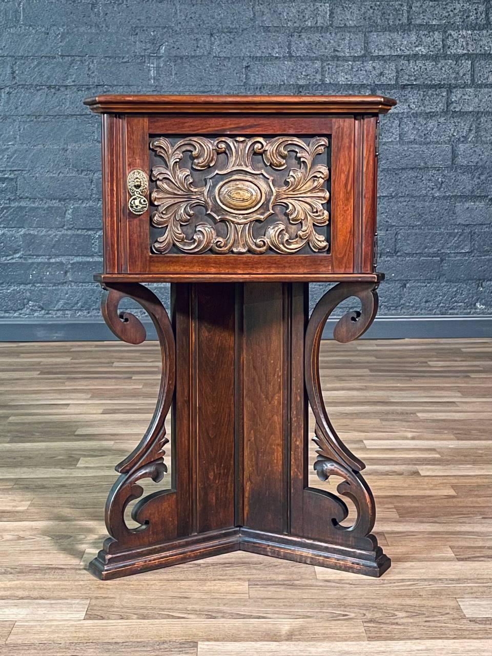 Condition: Original Vintage Condition
Materials: Copper Lined Humidor, Walnut, Resin Carved Panel, Brass Pull
Style: American Victorian

This American Victorian smoking cabinet from the 1920s beautifully captures the ornate craftsmanship of the era