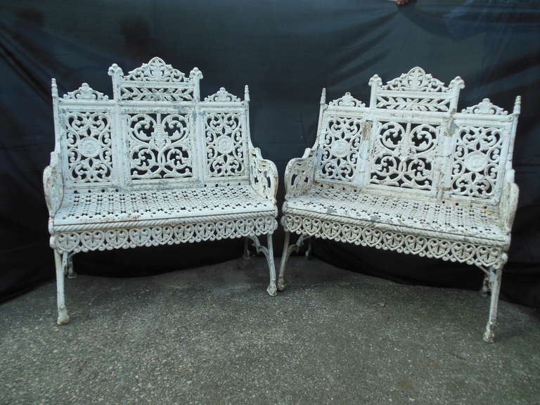 A desirable pair of cast iron benches in the 