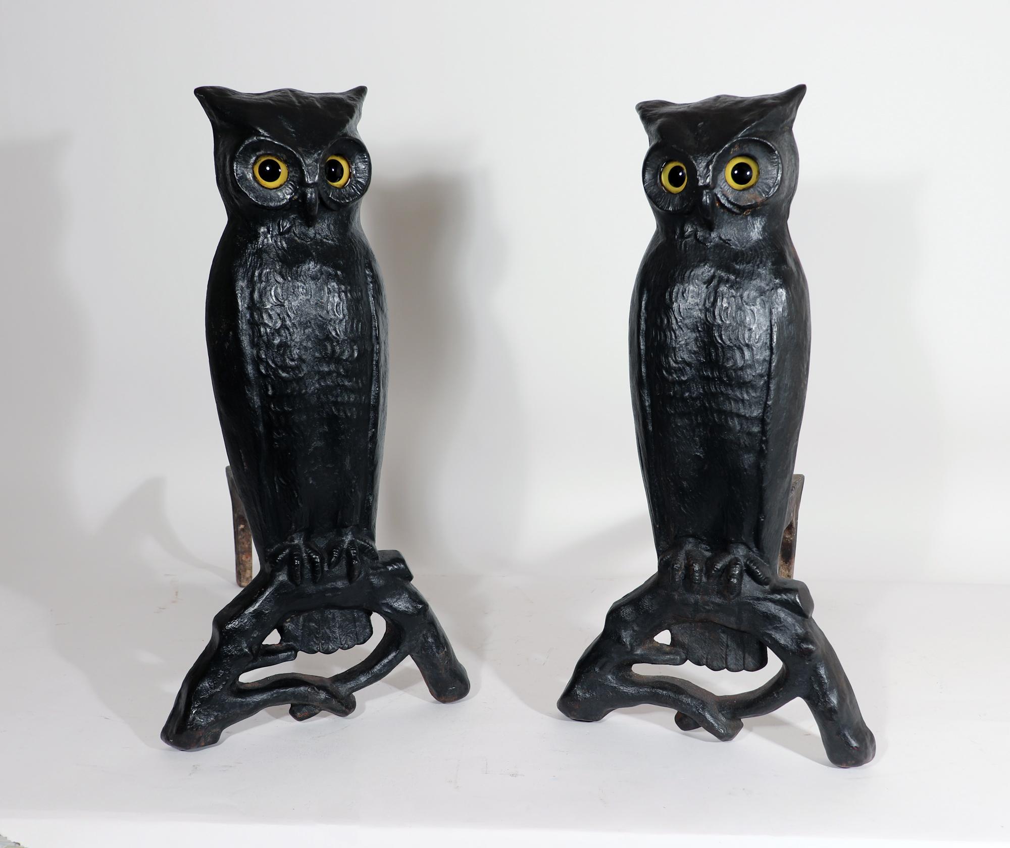 American Cast Iron Owl Andirons With Yellow Glass Eyes,
Circa 1900

The pair of cast iron andirons are each made in the form of a large owl standing on a log. The owls with their original yellow glass eyes. They have a lovely patina.

The dogs